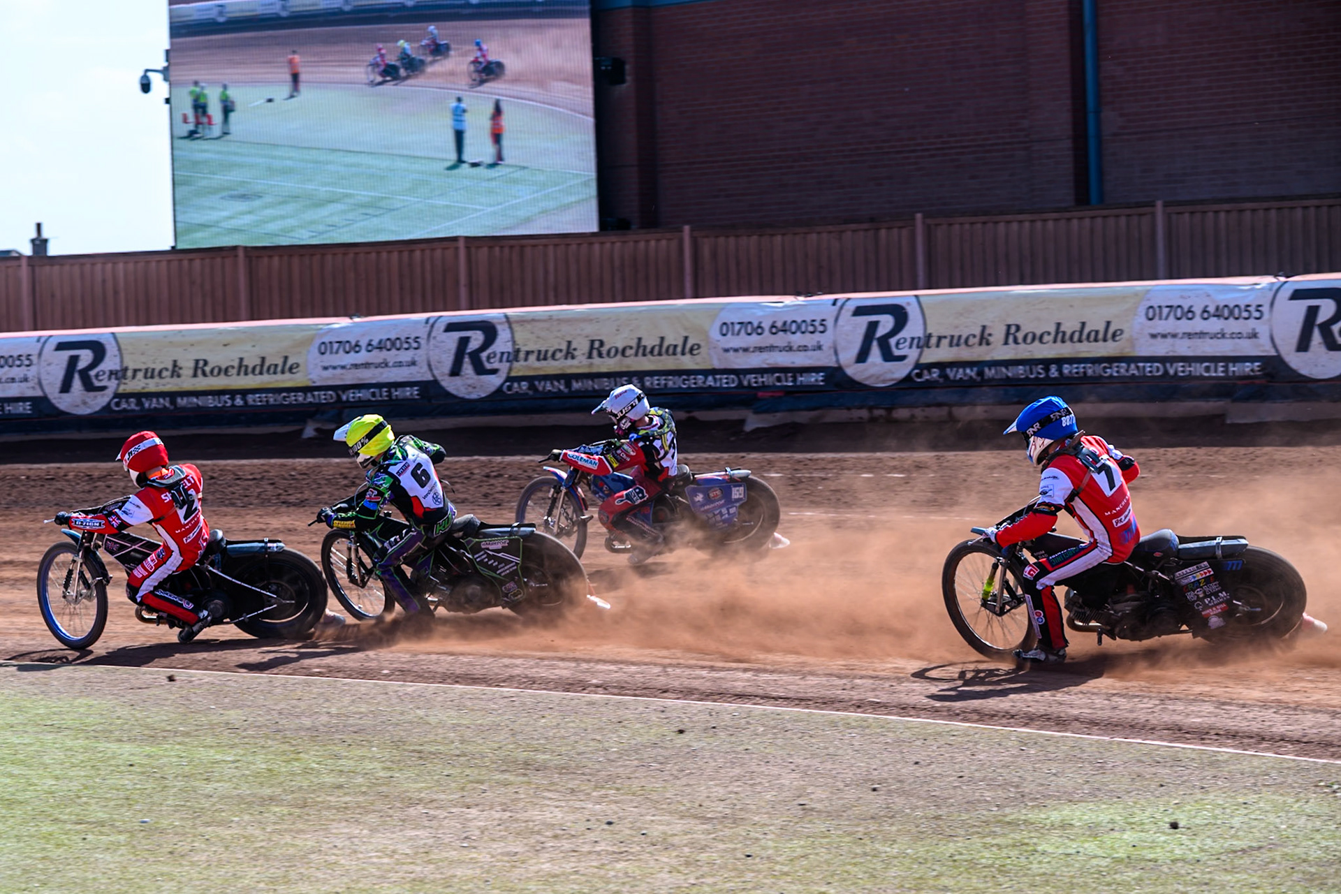 Billy Budd of Belle Vue Colts in Blue chases Jack Shimelt of Belle Vue Colts   in Red, Kai Ward of Middlesborough Tigers in Yellow and Stene Pijper of Middlesborough Tigers  in White  during the WSRA National Development League match between Belle Vue Colts and Middlesbrough Tigers at the National Speedway Stadium, Manchester on Sunday 10th August 2025. (Photo: Mark Fletcher | MI News)