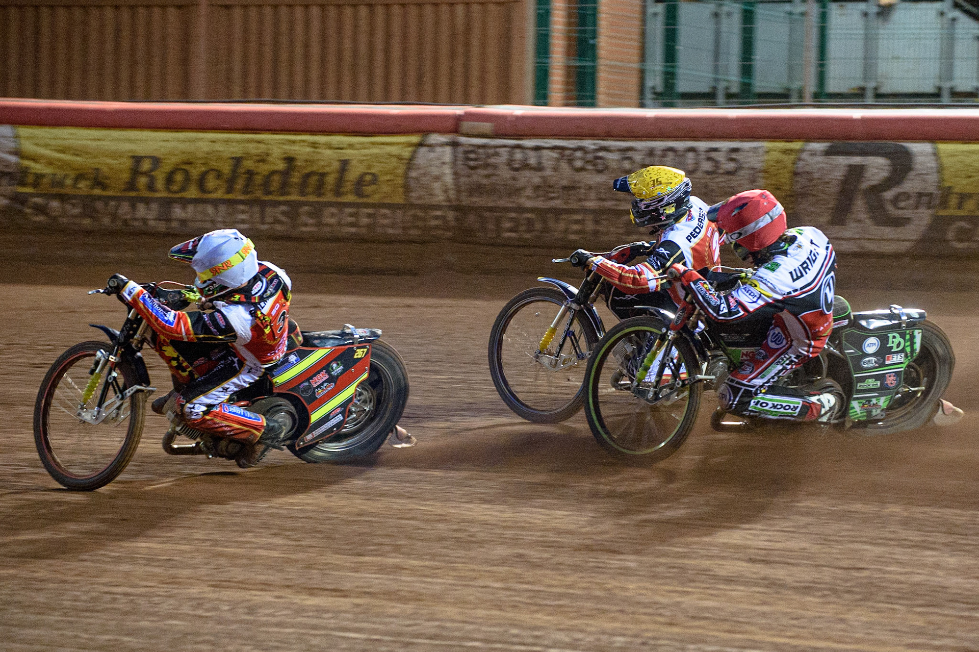 MANCHESTER, UK. AUG 9TH  Charles Wright  (Red) chases Michael Palm Toft  (White) and Bjarne Pedersen  (Yellow) during the SGB Premiership match between Belle Vue Aces and Peterborough at the National Speedway Stadium, Manchester on Monday 9th August 2021. (Credit: Ian Charles | MI News)