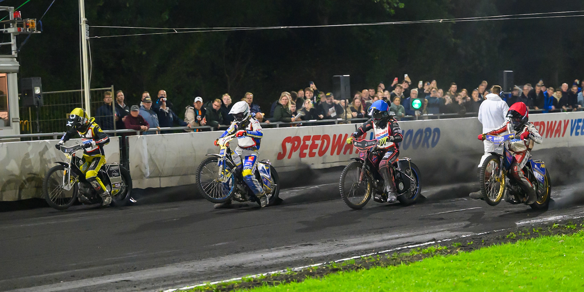 GOUDEN KENNY HELM FINAL: (L to R)  Mika Meijer of The Netherlands in Yellow, Rasmus Pedersen of Denmark in White, Glenn Moi of Norway in Blue, Jacob D. Jensen of Denmark in Red  leave the start during the Gouden KENNY Helm at Speedway Veenoord, Veenoord in the Netherlands on Saturday 19th September 2026. (Photo: Ian Charles | MI News)
