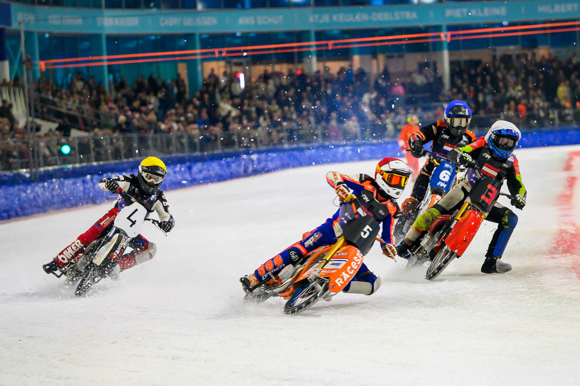 Netherlands v Austria Jasper Iwema (5) of The Netherlands  in Red rides outside Harald Simon (3) of Austria   in White with Martin Posch (4) of Austria  in Yellow and Sebastian Reitsma (6) of The Netherlands  in Blue behind during the FIM Ice Speedway Of Nations at Ice Rink Thialf, Heerenveen on Sunday 12th April 2026. (Photo: Ian Charles | MI News)
