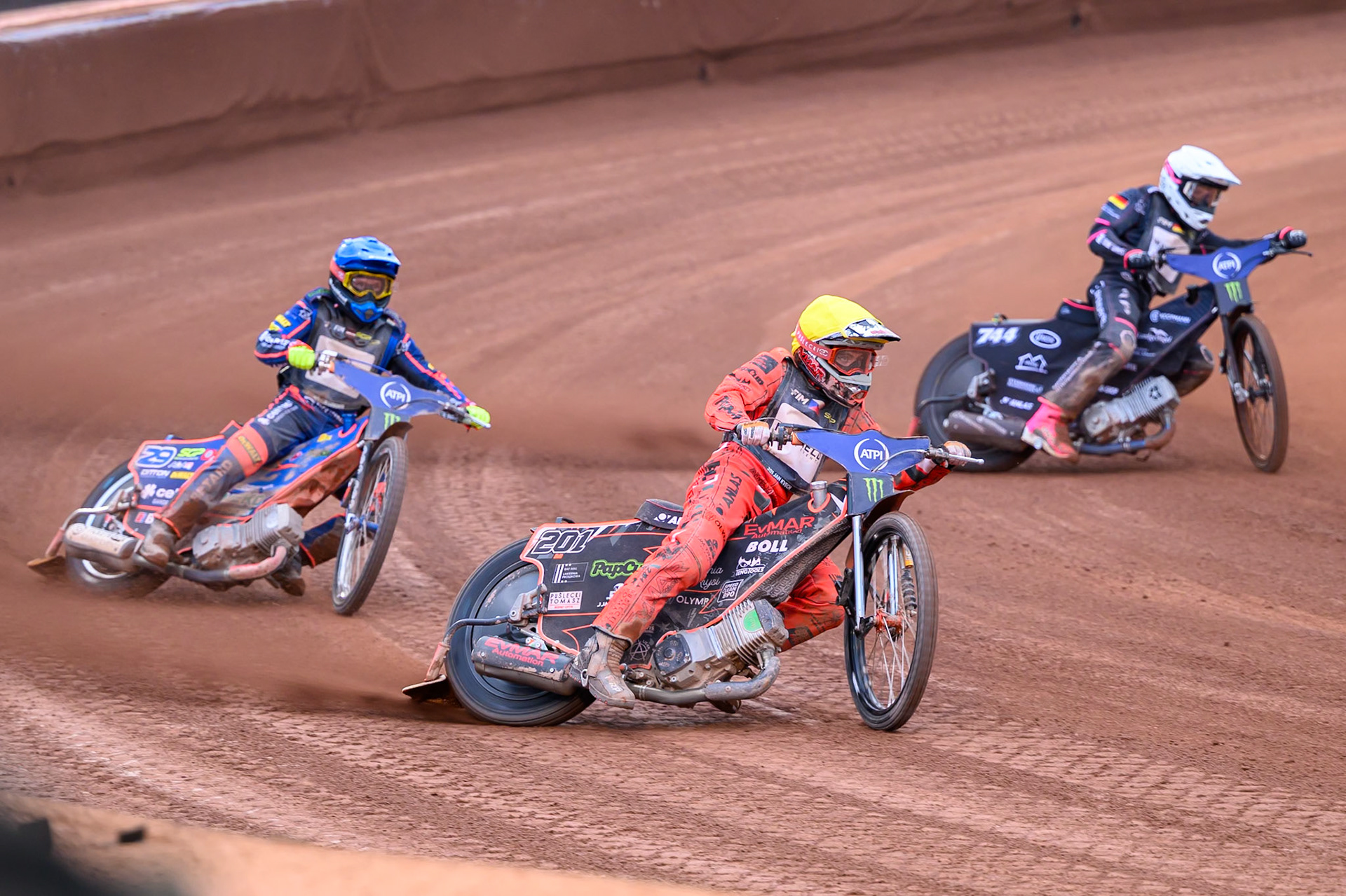 Jan Kvech (201) of Czech Republic in Yellow rides outside Kai Huckenbeck (744) of Germany in White with Andzejs Lebedevs (29) of Latvia in Blue behind during the ATPI  FIM Speedway GP of Manchester at the National Speedway Stadium, Manchester on Saturday 6th June 2026. (Photo: Ian Charles | MI News)