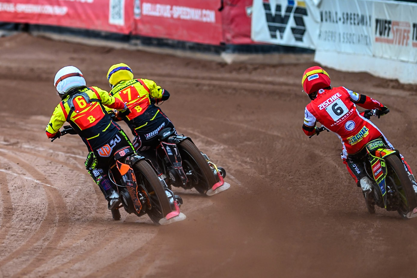 Birmingham Brummies' Guest Rider Jack Smith in White and Birmingham Brummies' Sam Hagon  \t\ with Belle Vue Aces' Tate Zischke  in Red on the outside during the Rowe Motor Oil Premiership match between Belle Vue Aces and Birmingham Brummies at the National Speedway Stadium, Manchester on Monday 7th July 2025. (Photo: Ian Charles | MI News)