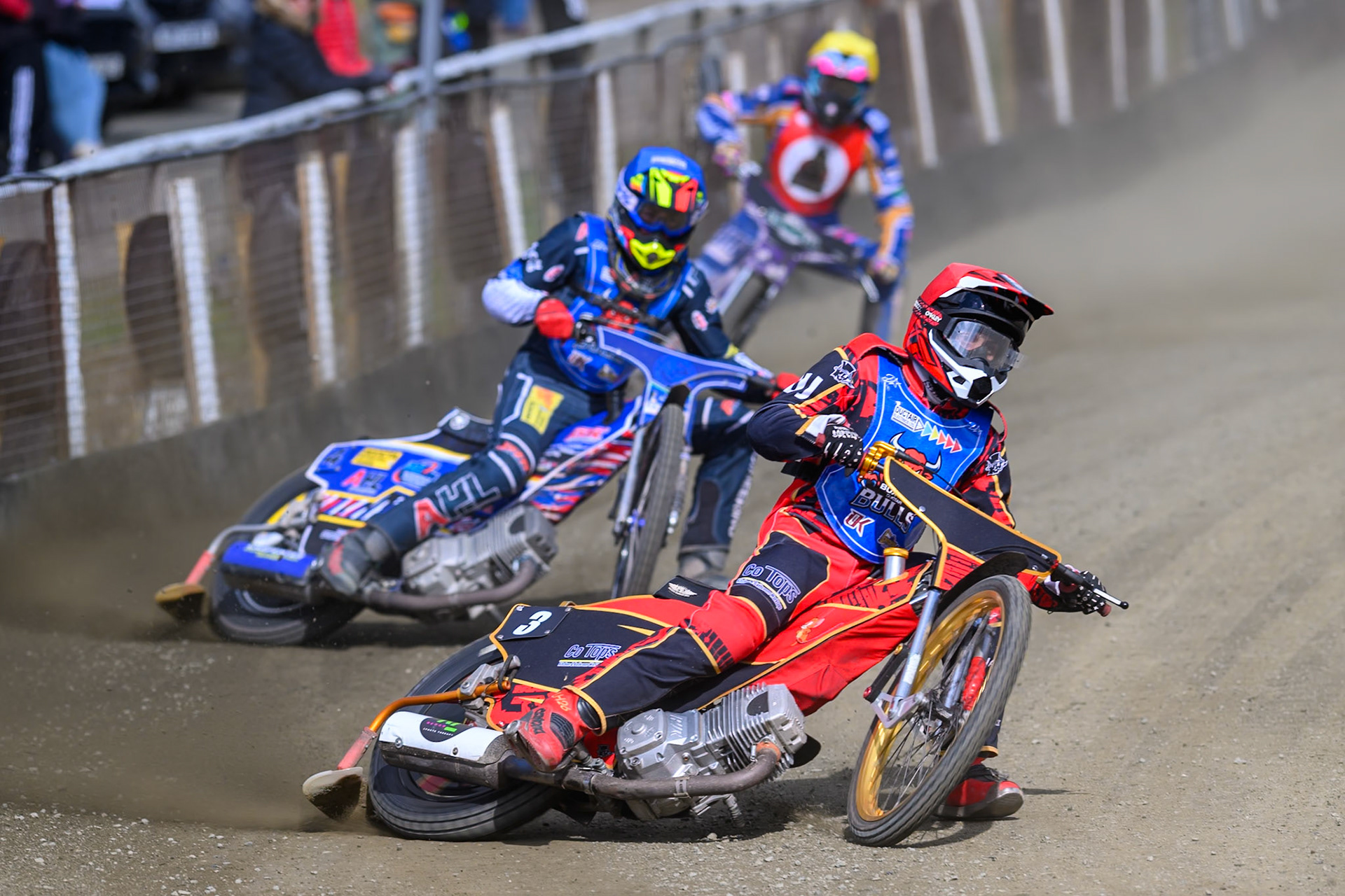Luke Harris of Buxton Bulls in Red and Jamie Etherington of Buxton Bulls  in Blue leading Sam Woods of NDL Nomads during the  Challenge match between Buxton Bulls and NDL Nomads at Hi-Edge Speedway, Buxton on Sunday 19th April 2026. (Photo: Ian Charles | MI News)