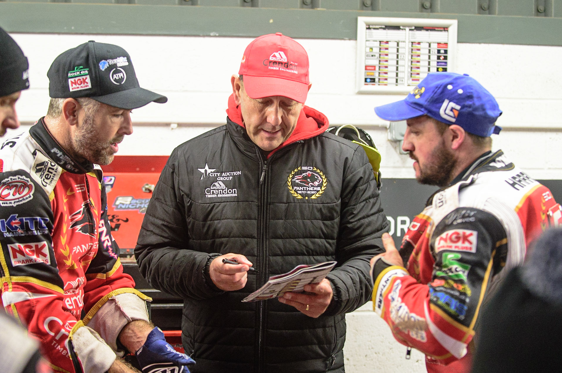 MANCHESTER, UK. OCT 11TH  Peterborough Crendon Panthers  manager Rob Lyon  (centre) with Scott Nicholls  (left) and Chris Harris   during the SGB Premiership Grand Final 1st Leg between Belle Vue Aces and Peterborough Panthers at the National Speedway Stadium, Manchester on Monday 11th October 2021. (Credit: Ian Charles | MI News)