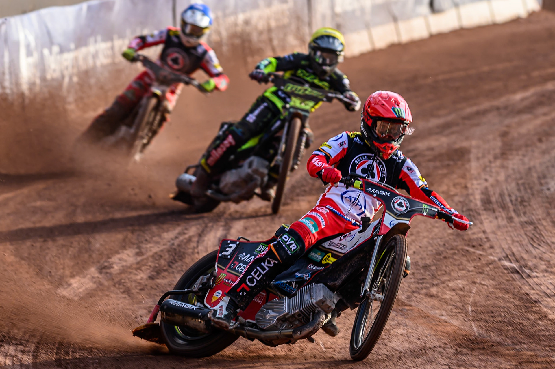 Belle Vue Aces' Jaimon Lidsey  in Red leading Ipswich Witches' Tom Brennan  in Yellow and Belle Vue Aces' Zach Cook  in Blue during the Rowe Motor Oil Premiership match between Belle Vue Aces and Ipswich Witches at the National Speedway Stadium, Manchester on Monday 30th June 2025. (Photo: Ian Charles | MI News)