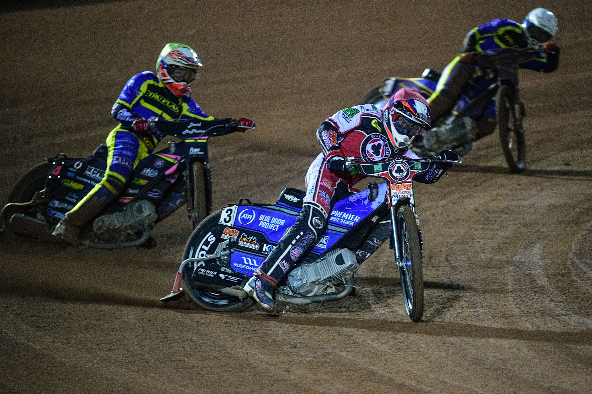 MANCHESTER, UK. OCT 7TH  Steve Worrall   (Red) leads Josh Pickering   (Yellow) and Kyle Howarth  (White) during the SGB Premiership Play off Semi-Final Second Leg between Belle Vue Aces and Sheffield Tigers at the National Speedway Stadium, Manchester on Thursday 7th October 2021. (Credit: Ian Charles | MI News)