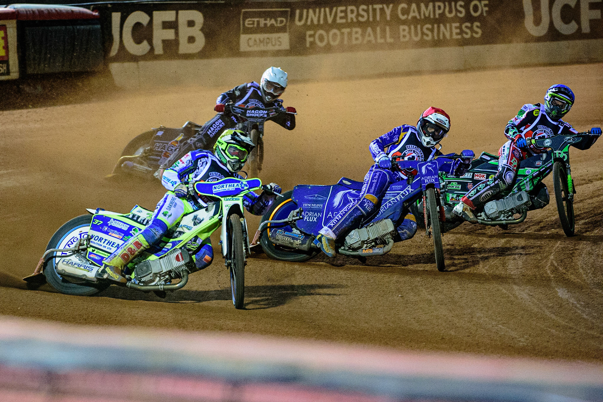 MANCHESTER, UK. OCT 23RD  Chris Harris  (Yellow) outside Lewis Kerr  (Red) and Charles Wright  (Blue) with Broc Nicol  (White) behind during the Peter Craven Memorial Trophy event at the National Speedway Stadium, Manchester on Saturday 23rd October 2021. (Credit: Ian Charles | MI News)