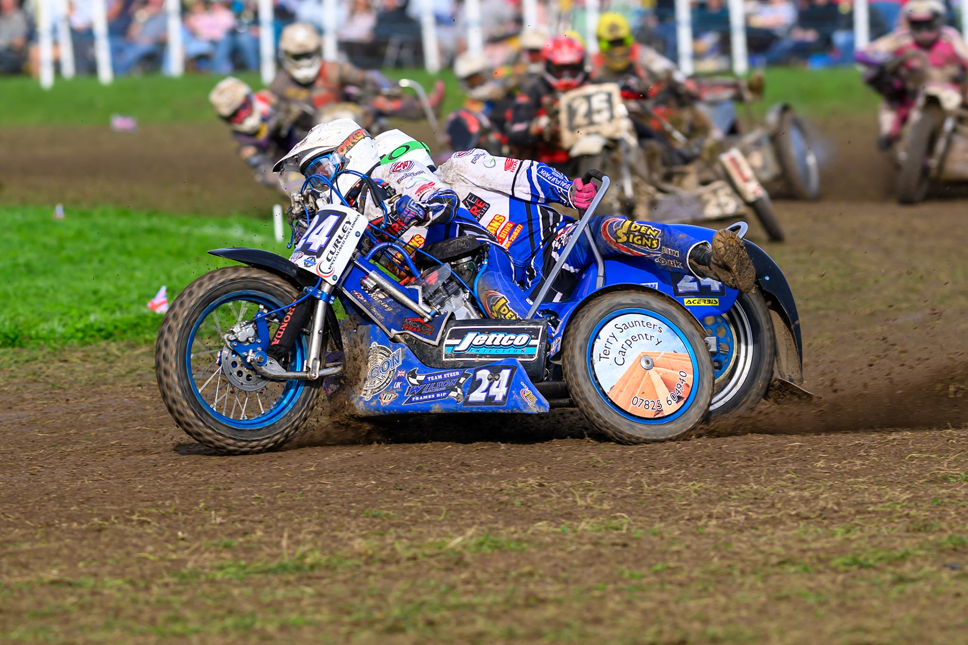 British Masters 1000cc Sidecars: Terry Saunters/Liam Brown (24)  leading  the pack during the British Masters Grasstrack Championship at Lower Marsh Farm, Much Hoole, Preston in Lancashire, England on Sunday 13th September 2026. (Photo: Ian Charles | MI News)