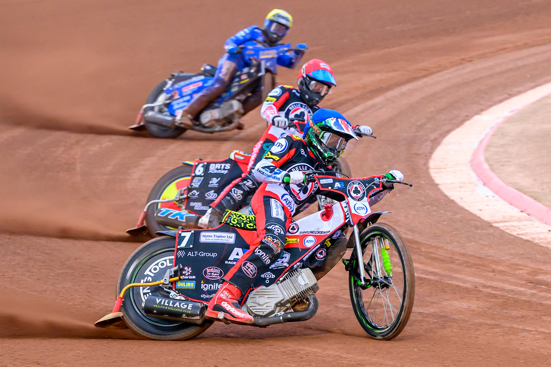 William Cairns of Belle Vue Aces in Blue leading Tate Zischke of Belle Vue Aces in Red  and Jody Scott of Kings Lynn Stars in Yellow  during the Rowe Motor Oil Premiership match between Belle Vue Aces and King's Lynn Stars at the National Speedway Stadium, Manchester on Monday 29th June 2026. (Photo: Ian Charles | MI News)