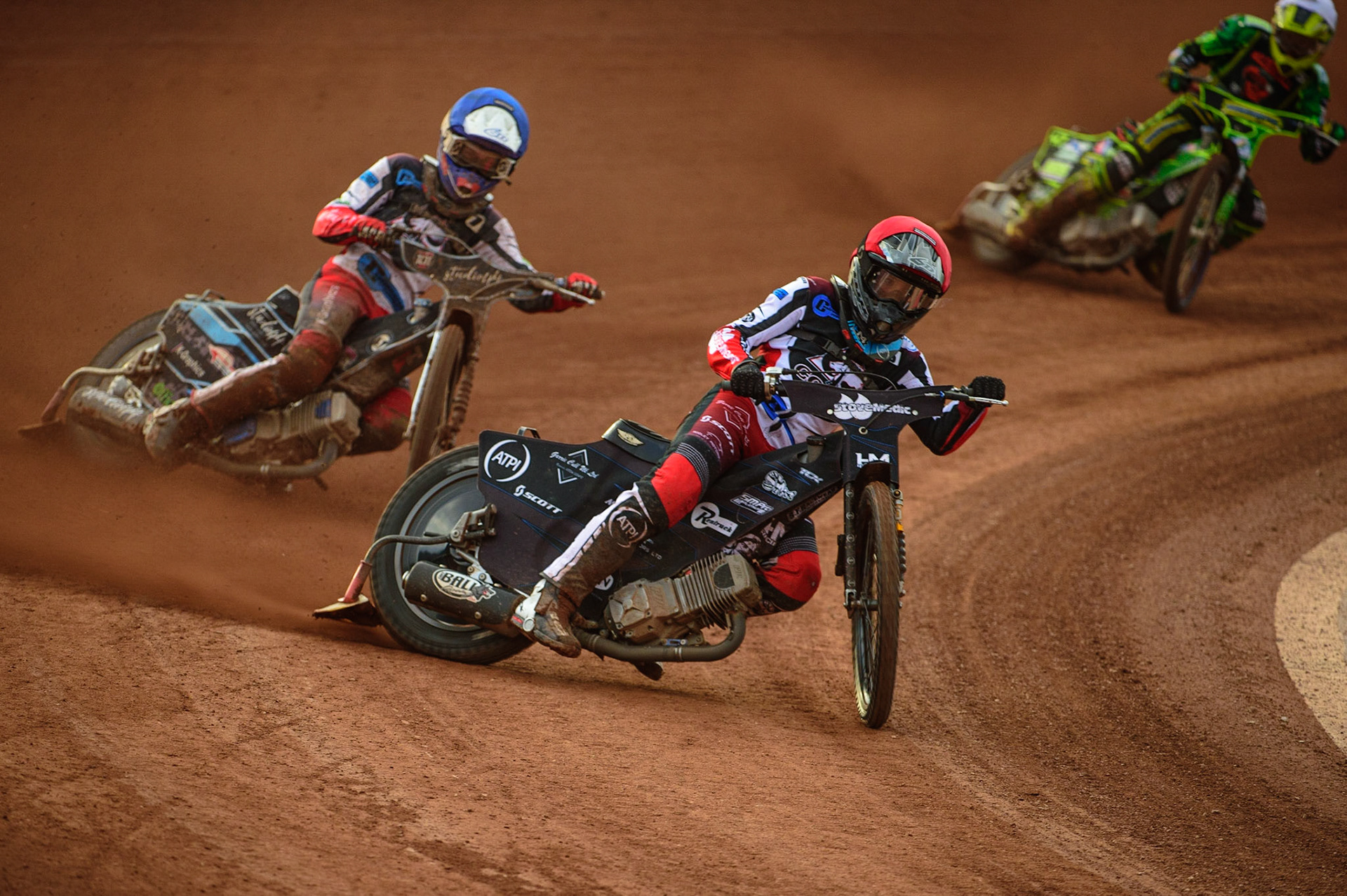 Freddy Hodder  (Blue) leads Harry McGurk  (Red) and Sam Bebee  (White)during the National Development League match between Belle Vue Colts and Mildenhall Fens Tigers at the National Speedway Stadium, Manchester on Friday 15th July 2022. (Credit: Ian Charles | MI News)