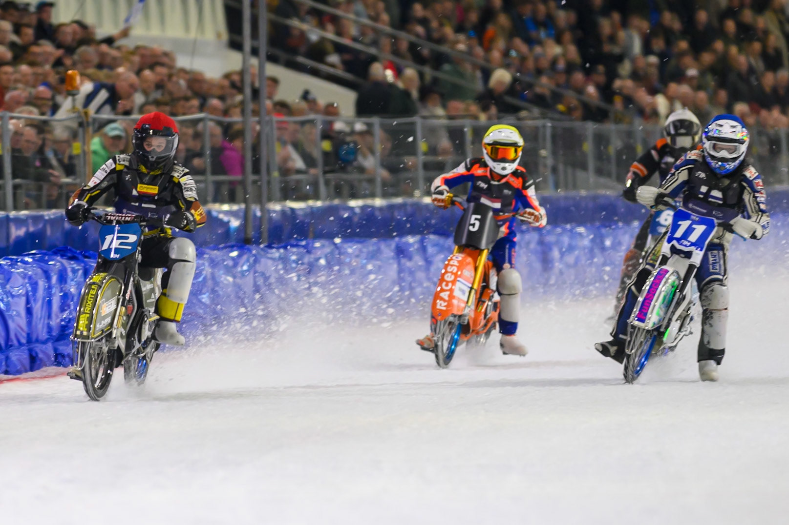 Finland v Netherlands: Heikki Huusko (12) of Finland  in Red and Max Koivula (11) of Finland  in Blue leading Jasper Iwema (5) of The Netherlands  in Yellow and Sebastian Reitsma (6) of The Netherlands  in White during the FIM Ice Speedway Of Nations at Ice Rink Thialf, Heerenveen on Sunday 12th April 2026. (Photo: Ian Charles | MI News)