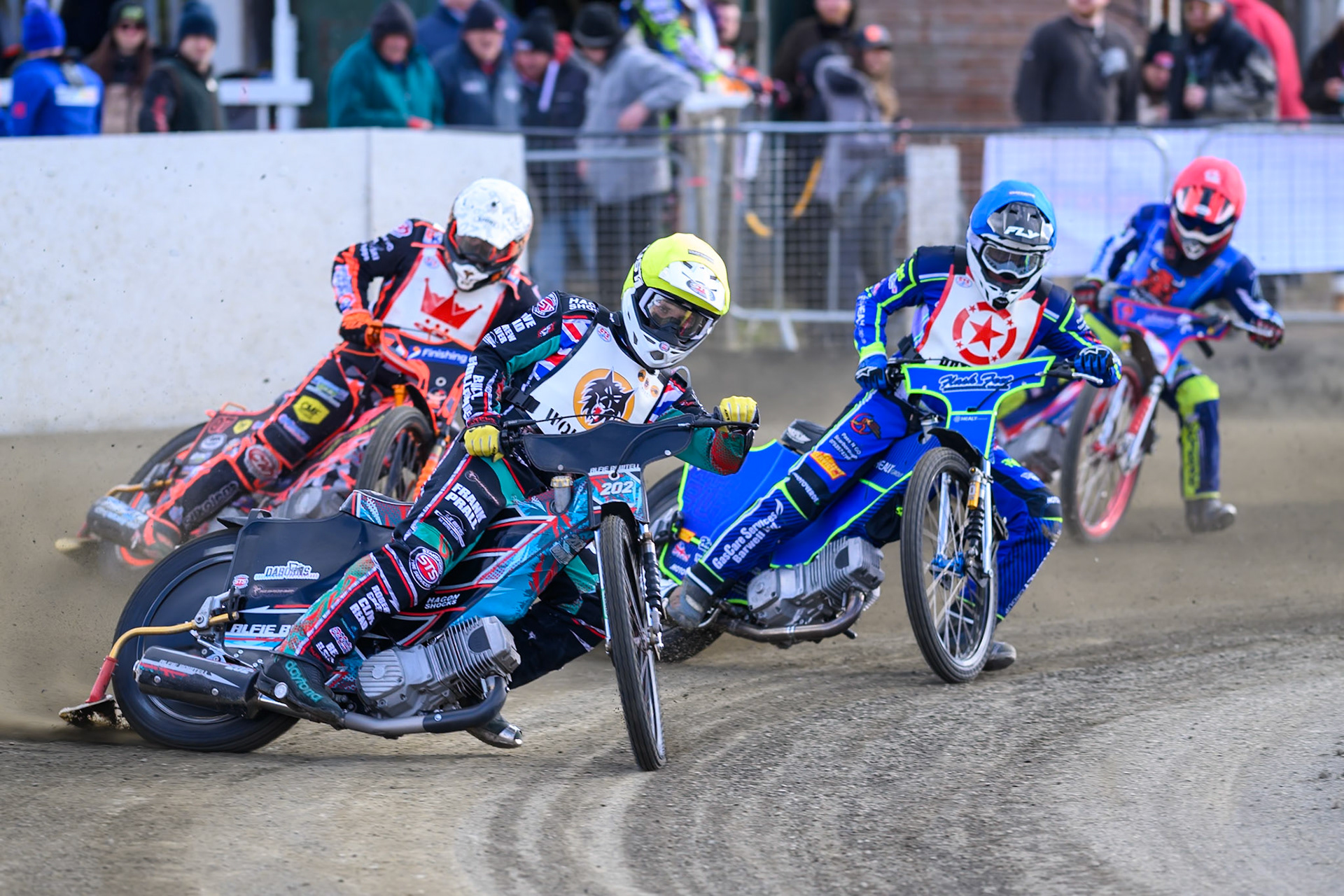 Alfie Bowtell of 'The Wolves'  in Yellow leading Arran Butcher of 'The Potters'  in Blue Alex Spooner of 'The Kings' in White and Harry Sadler of Buxton Bulls in Red during the Regina Chains Fours at Buxton Speedway, Buxton on Sunday 5th April 2026. (Photo: Ian Charles | MI News)