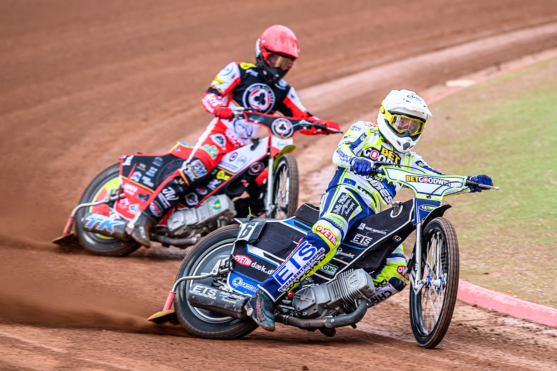 Oxford Spires' Peter Kildemand in White leading Belle Vue Aces' Tate Zischke in Red during the Rowe Motor Oil Premiership match between Belle Vue Aces and Oxford Spires at the National Speedway Stadium, Manchester on Monday 26th May 2025. (Photo: Ian Charles | MI News)