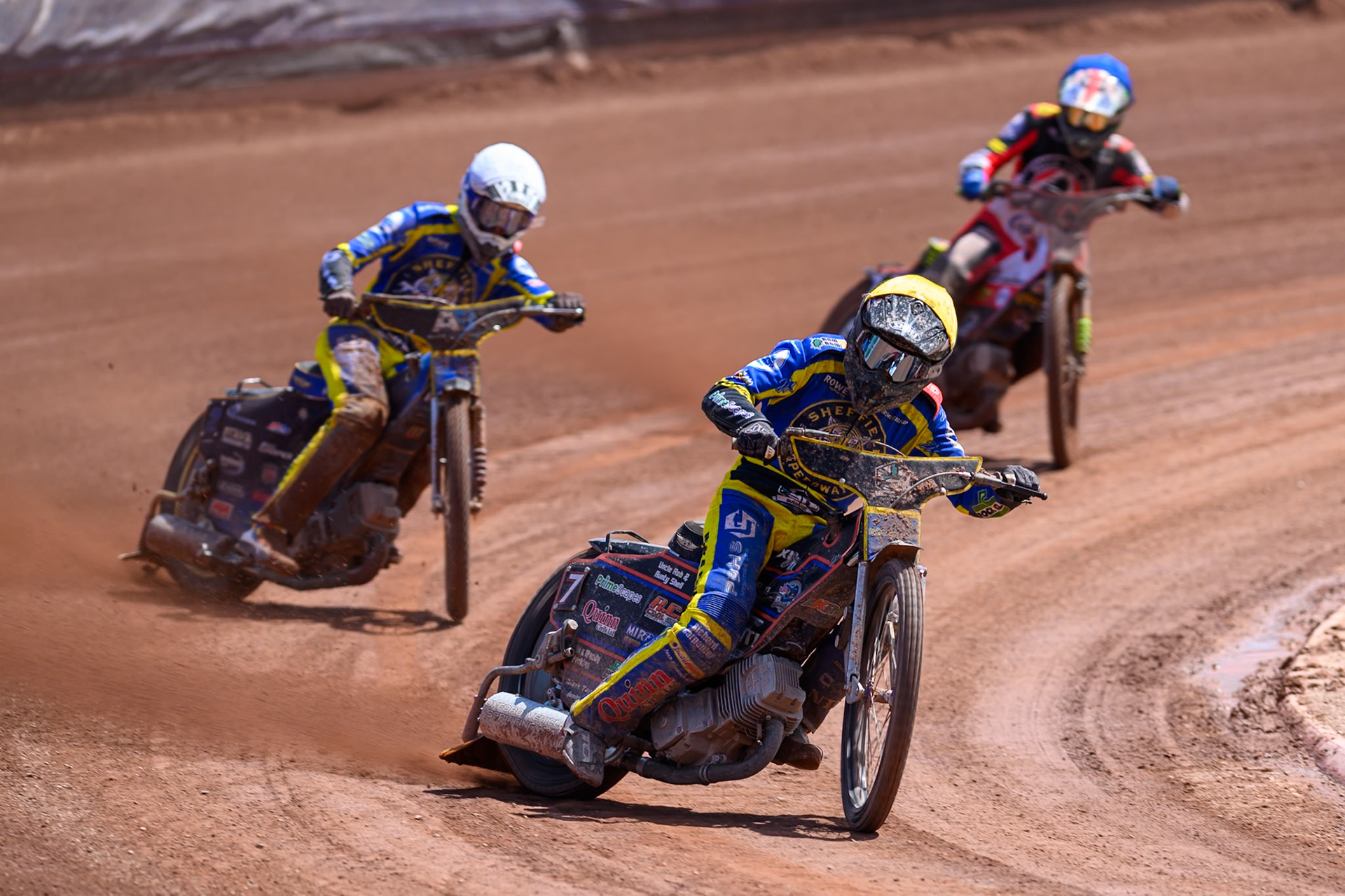 Luke Killeen of Sheffield Tigers in Yellow leading Anders Rowe of Sheffield Tigers in White and Will Cairns of Belle Vue Aces in Blue during the Rowe Motor Oil Premiership match between Belle Vue Aces and Sheffield Tigers at the National Speedway Stadium, Manchester on Monday 25th May 2026. (Photo: Ian Charles | MI News)