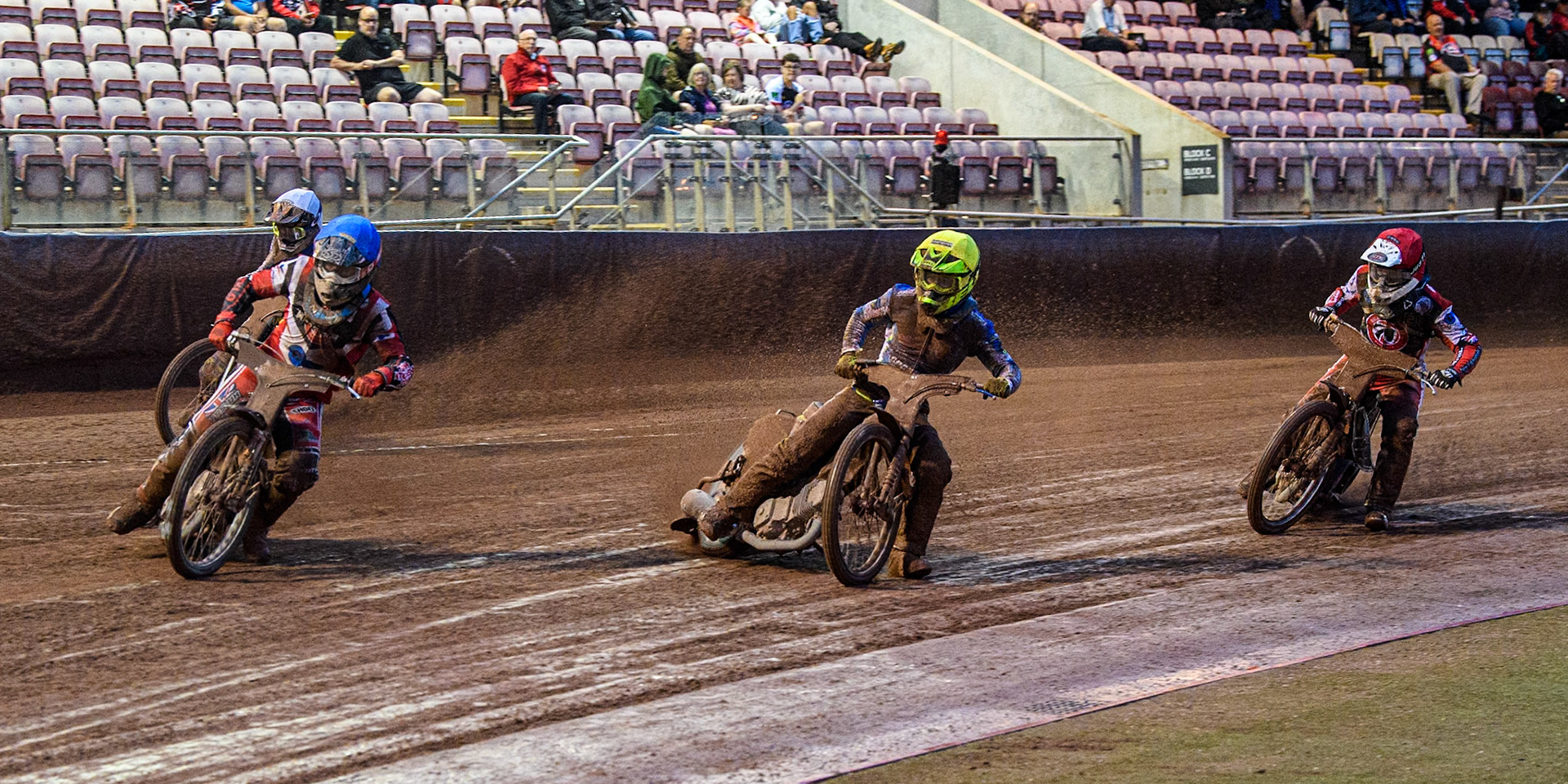 Belle Vue Colts' Harry McGurk  in Blue leading Oxford Chargers' Jacob Clouting  in Yellow, Oxford Chargers' Senna Summers in White and Belle Vue Colts' Jack Shimelt  in Red during the WSRA National Development League match between Belle Vue Colts and Oxford Chargers at the National Speedway Stadium, Manchester on Friday 2nd August 2024. (Photo: Ian Charles | MI News)