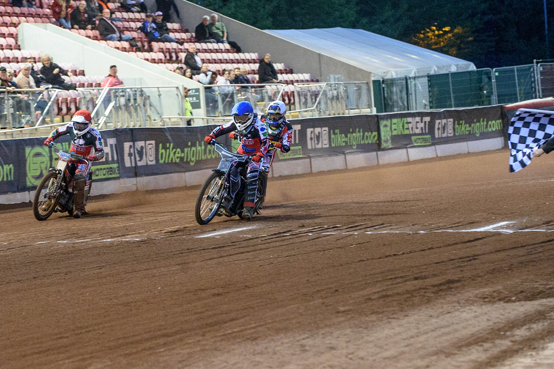 MANCHESTER, UK. JULY 29TH  Sam McGurk  (Blue) and Paul Bowen  (Red) take the maximum heat win over Tom Spencer   (White)  during the National Development League match between Belle Vue Colts and Leicester Lion Cubs at the National Speedway Stadium, Manchester on Thursday 29th July 2021. (Credit: Ian Charles | MI News)