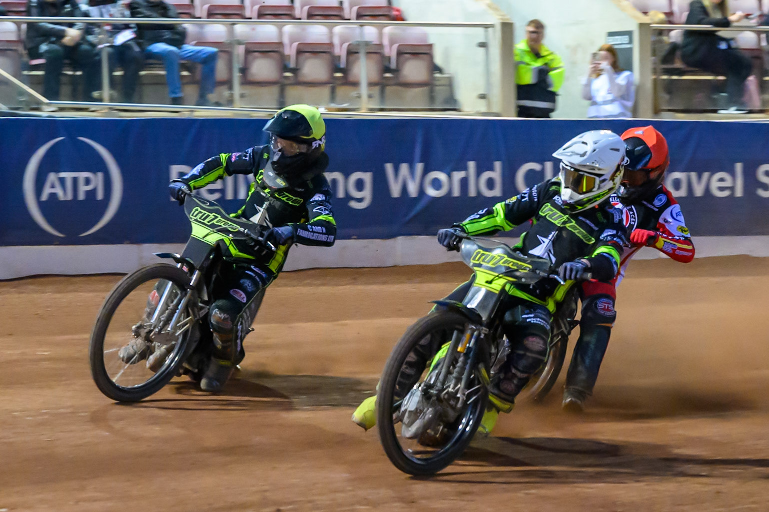 Tom Brennan of Ipswich Witches  in White and Dan Thompson of Ipswich Witches  in Yellow leading Zach Cook of Belle Vue Aces  in Red during the Rowe Motor Oil Premiership match between Belle Vue Aces and Ipswich Witches at the National Speedway Stadium, Manchester on Monday 4th August 2025. (Photo: Ian Charles | MI News)