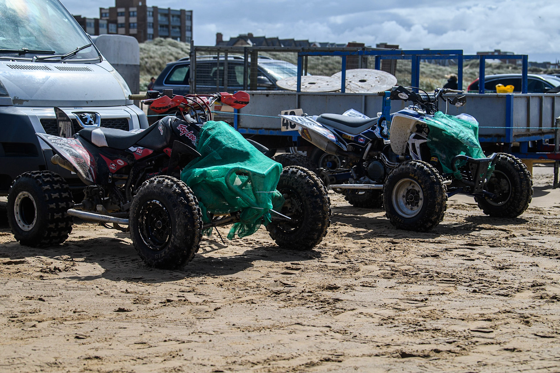 Two of the quad bikes with netting to stop the sand getting into the engine during the Fylde ACU British Sand Racing Masters Championship at  St Annes on Sea, Lancashire on Sunday 30th July 2023. (Photo: Ian Charles | MI News)