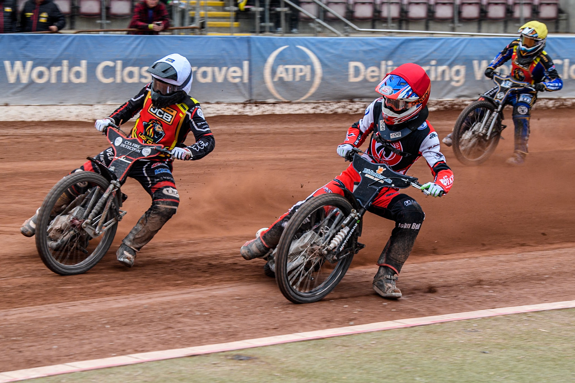Belle Vue Colts' Freddy Hodder in Red rides inside Leicester Lion Cubs' Guest Rider Ben Morley in White with Leicester Lion Cubs' Eli Meadows  in Yellow behind during the WSRA National Development League match between Belle Vue Colts and Leicester Lion Cubs at the National Speedway Stadium, Manchester on Friday 18th April 2025. (Photo: Ian Charles | MI News)