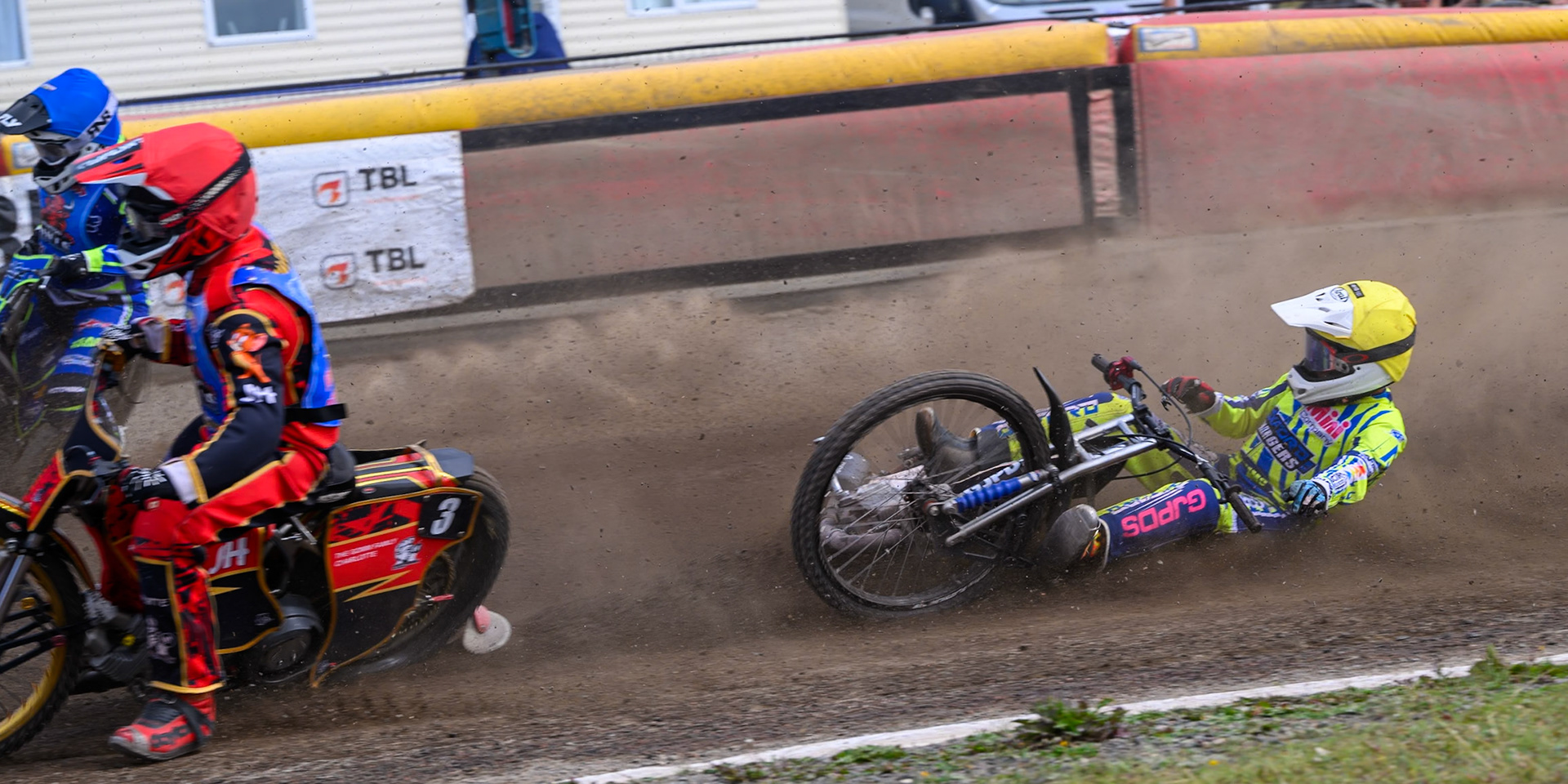 Harry Fletcher of Oxford Chargers in Yellow  falls behind Luke Harris of Buxton Bulls in Red  and Arran Butcher of Buxton Bulls in Blue  during the WSRA National Development League match between Buxton Bulls and Oxford Chargers at Hi-Edge Speedway, Buxton on Sunday 2nd August 2026. (Photo: Ian Charles | MI News)
