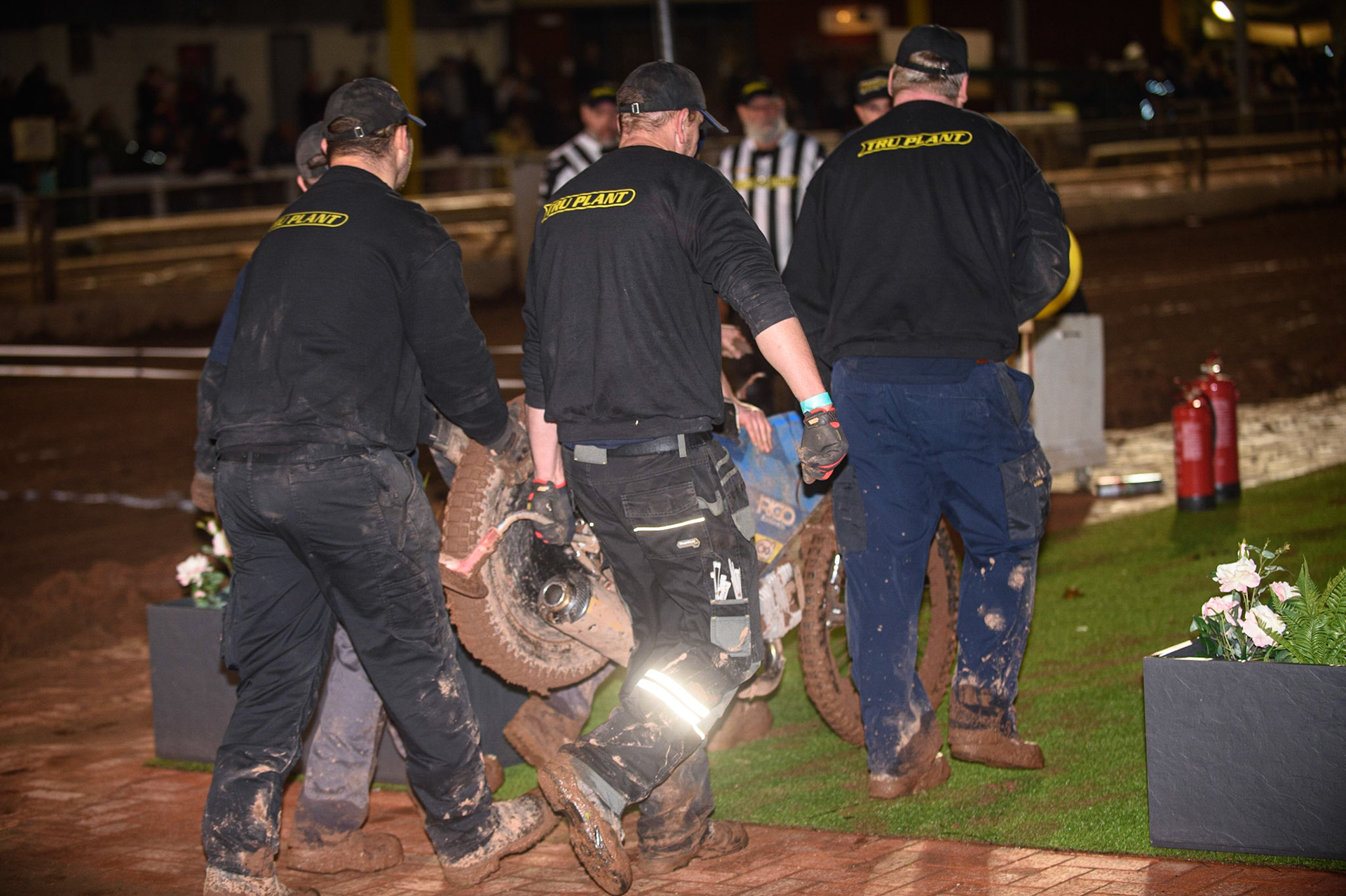 SHEFFIELD, UK. OCT 4THTrack staff carry Adam Ellis’ bike off after his fall during the SGB Premiership Semi Final Playoff 1st Leg between Sheffield Tigers and Belle Vue Aces at Owlerton Stadium, Sheffield on Monday 4th October 2021. (Credit: Ian Charles | MI News)