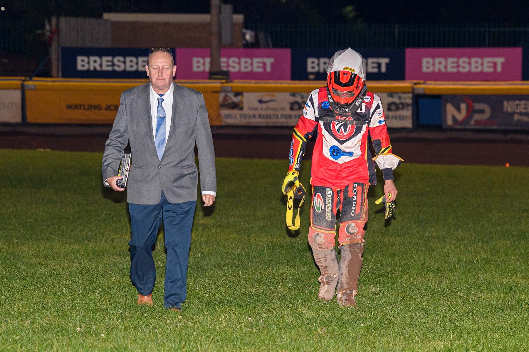 Belle Vue Colts' Guest Rider Max James (Left) walks back to the pits with the Clerk Of The Course, Neville Stanley after his fall in during the WSRA National Development League match between Sheffield Tiger Cubs and Belle Vue Colts at Owlerton Stadium, Sheffield on Thursday 12th September 2024. (Photo: Ian Charles | MI News)