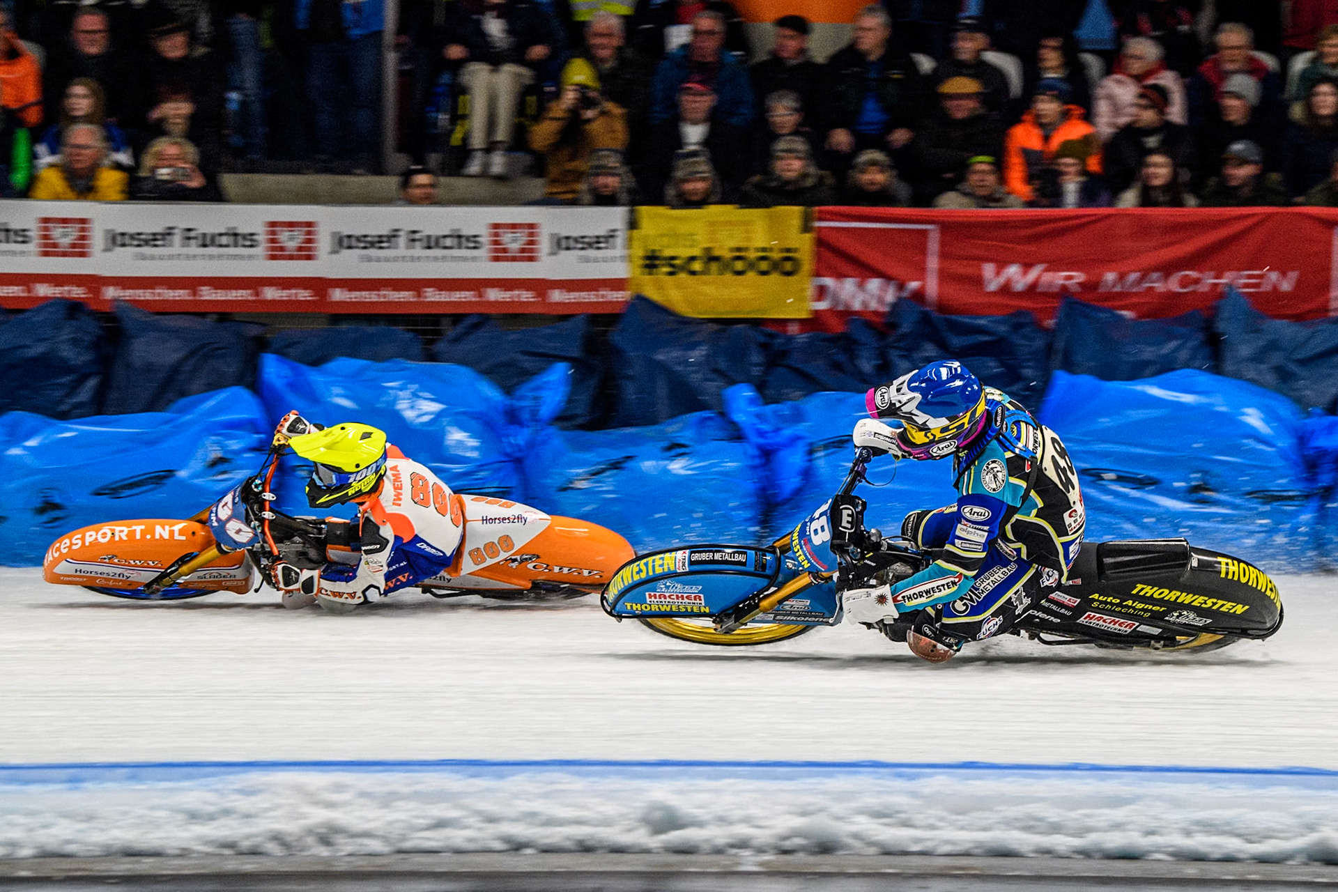 Jasper Iwema (800) of The Netherlands in Yellow passes Luca Bauer (48) of Germany in Blue during the Ice Speedway Gladiators World Championship Final 1 at Max-Aicher-Arena, Inzell on Saturday 15th March 2025. (Photo: Ian Charles | MI News)