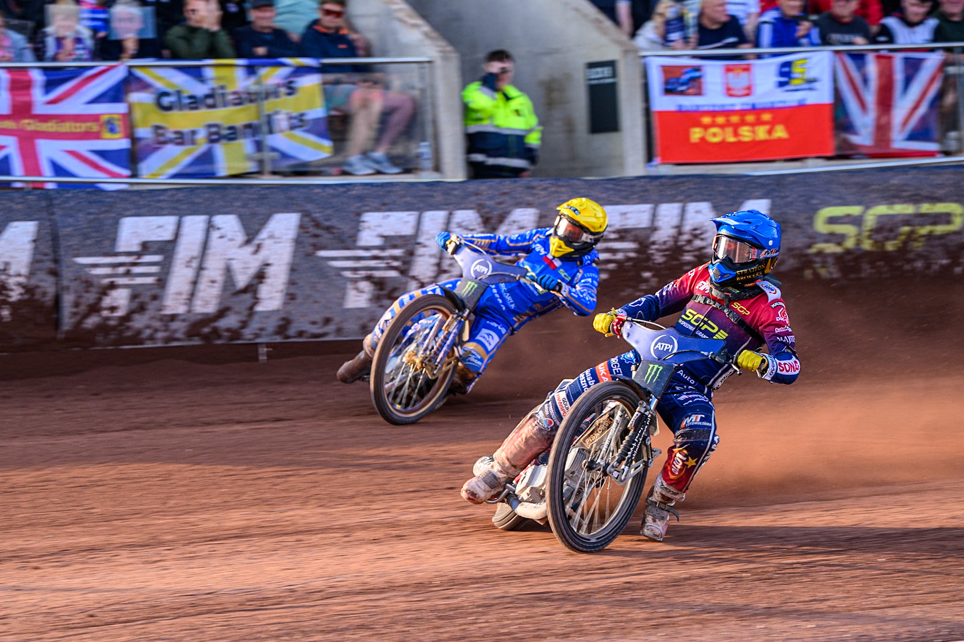 Dominik Kubera (415) of Poland in Blue leading Bartosz Zmarzlik (95) of Poland in Yellow during the ATPI FIM Speedway Grand Prix Round 5 at the National Speedway Stadium, Manchester, on Saturday 14th June 2025. (Photo: Ian Charles | MI News)
