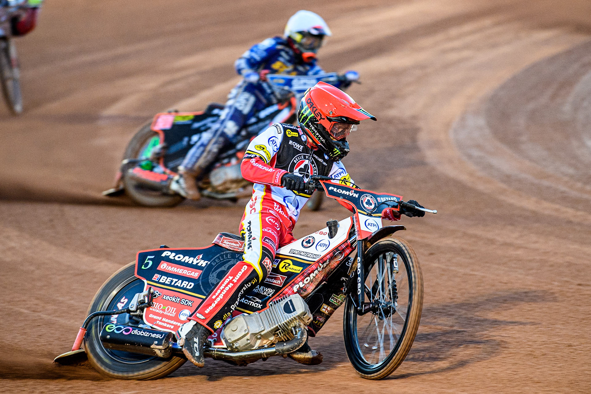 Dan Bewley of Belle Vue Aces in Red leading Jan Kvech of Kings Lynn Stars in White during the Rowe Motor Oil Premiership match between Belle Vue Aces and King's Lynn Stars at the National Speedway Stadium, Manchester on Monday 5th April 2025. (Photo: Ian Charles | MI News)