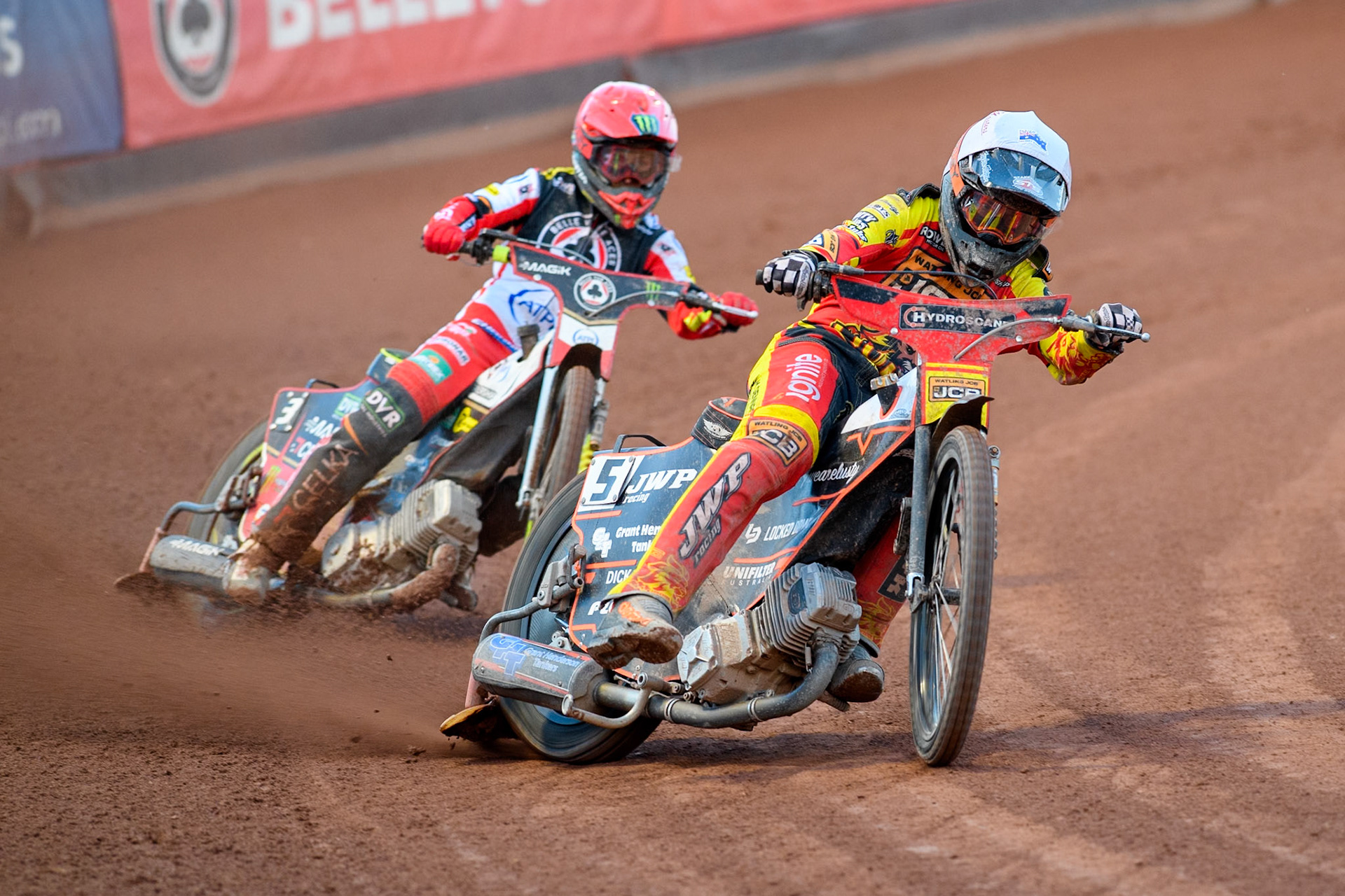 Leicester Lions' Sam Masters in White leading Belle Vue Aces' Jaimon Lidsey in Red during the Rowe Motor Oil Premiership match between Belle Vue Aces and Leicester Lions at the National Speedway Stadium, Manchester on Monday 19th May 2025. (Photo: Ian Charles | MI News)