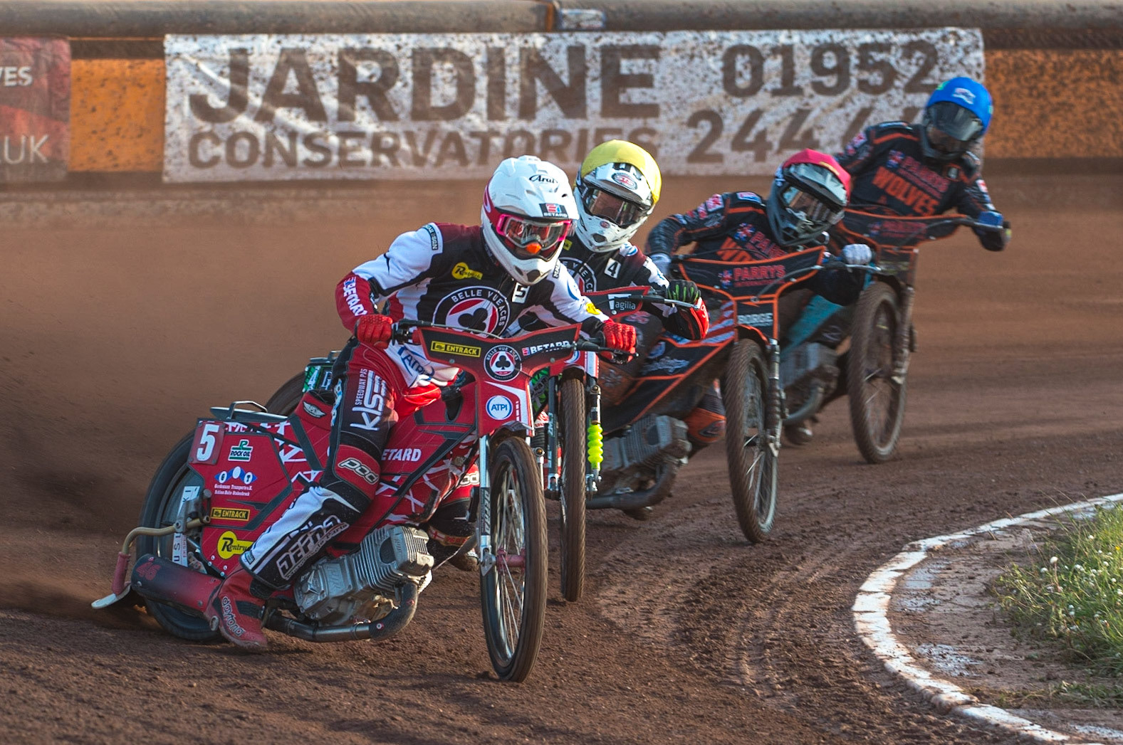 WOLVERHAMPTON, UK. JUN 20TH Max Fricke  (White) leads team mate Charles Wright  (Yellow) Luke Bekker  (Red) and Ryan Douglas  (Blue) during the SGB Premiership match between Wolverhampton Wolves and Belle Vue Aces at Monmore Green Stadium, Wolverhampton on Monday 20th June 2022. (Credit: Ian Charles | MI News)