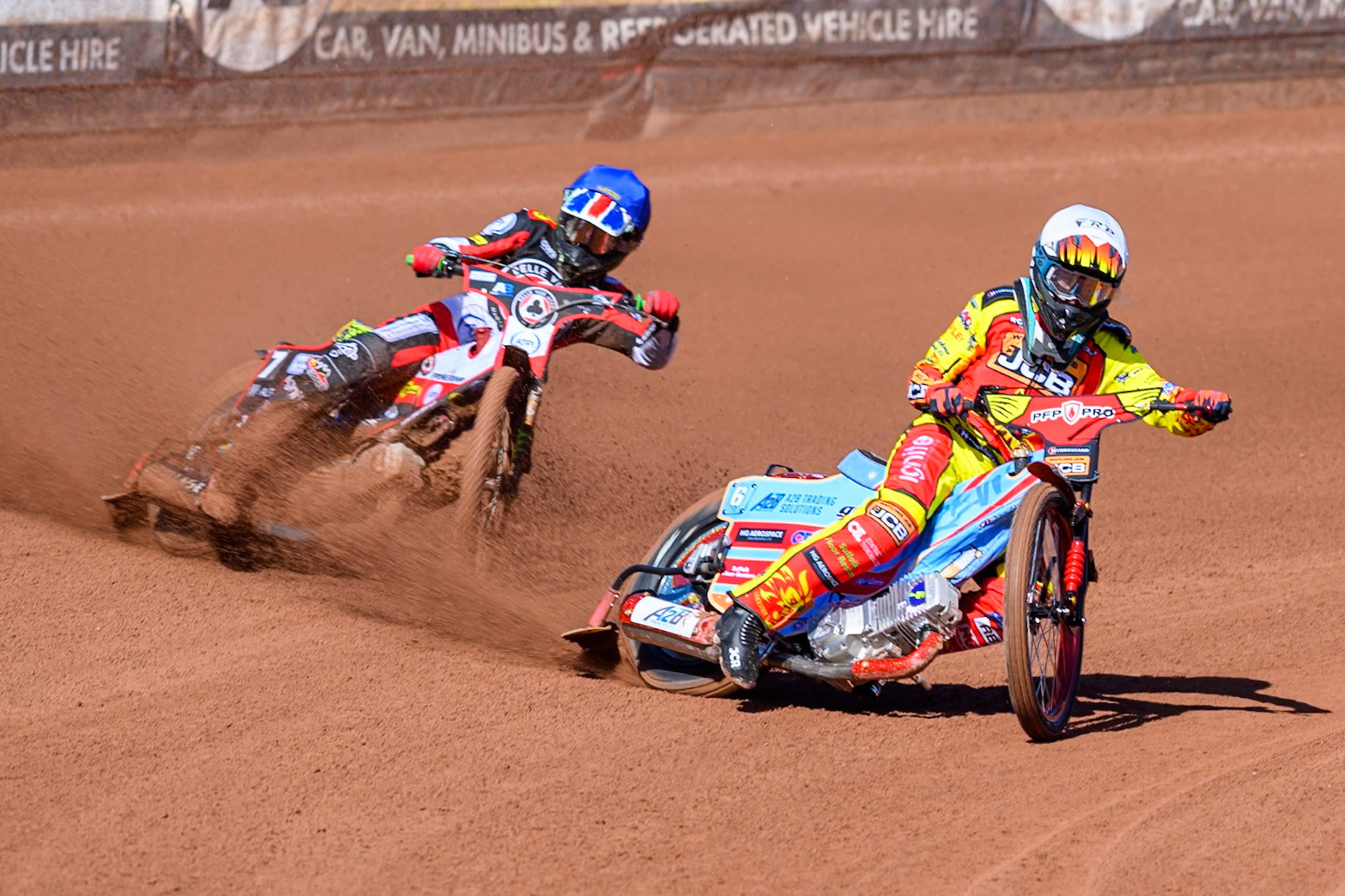 Drew Kemp of Leicester Lions  in White leading William Cairns of Belle Vue Aces  in Blue during the Knockout Cup Northern Section match between Belle Vue Aces and Leicester Lions at the National Speedway Stadium, Manchester on Monday 6th April 2026. (Photo: Ian Charles | MI News)