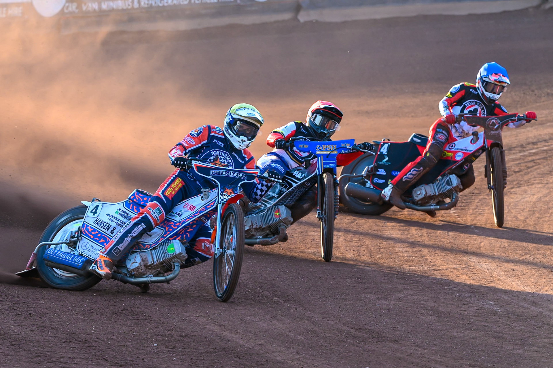 Niels-Kristian Iversen of Northampton Foxes in Yellow leading Ben Cook, Guest Rider for Belle Vue Aces in Red and Zach Cook of Belle Vue Aces  in Blue  during the Rowe Motor Oil Premiership match between Belle Vue Aces and Northampton Foxes at the National Speedway Stadium, Manchester on Monday 13th July 2026. (Photo: Ian Charles | MI News)