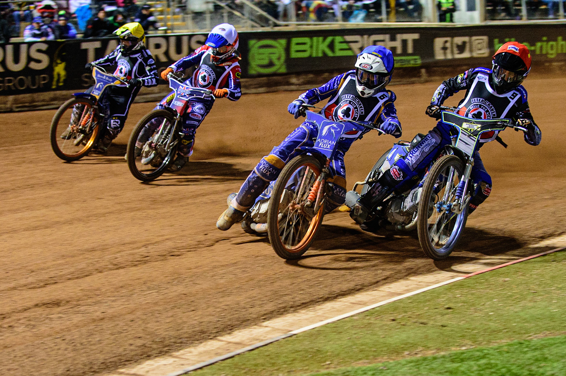 MANCHESTER, UK. OCT 23RD  Lewis Kerr  (Blue) leads Ryan Douglas  (Red) with Jordan Palin  (White) and Erik Riss on the outside during the Peter Craven Memorial Trophy event at the National Speedway Stadium, Manchester on Saturday 23rd October 2021. (Credit: Ian Charles | MI News)