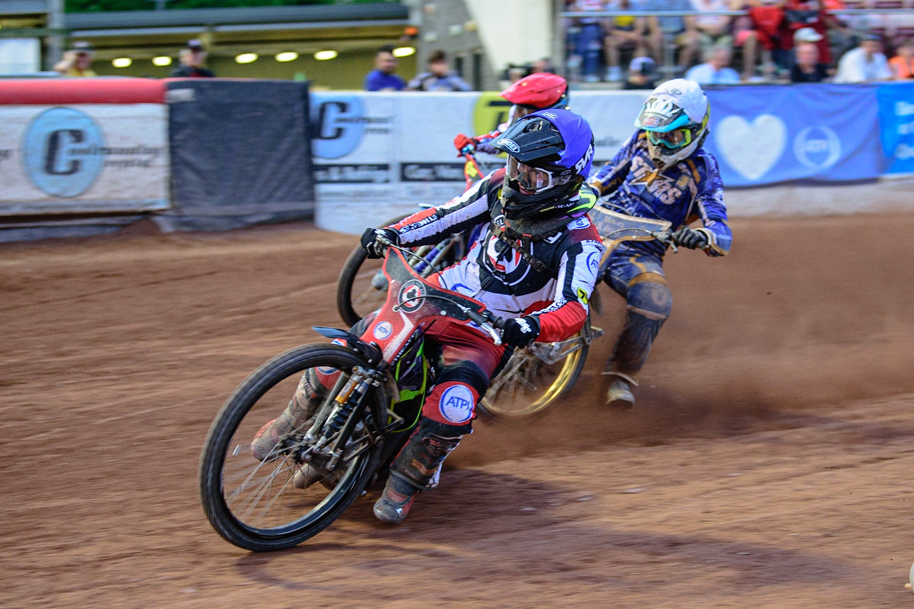 MANCHESTER UK  Tom Brennan  (Blue) leads Richard Lawson  (White) and Matej Zagar  (Red) during the SGB Premiership match between Belle Vue Aces and King's Lynn Stars at the National Speedway Stadium, Manchester on Monday 11th July 2022. (Credit: Ian Charles | MI News)