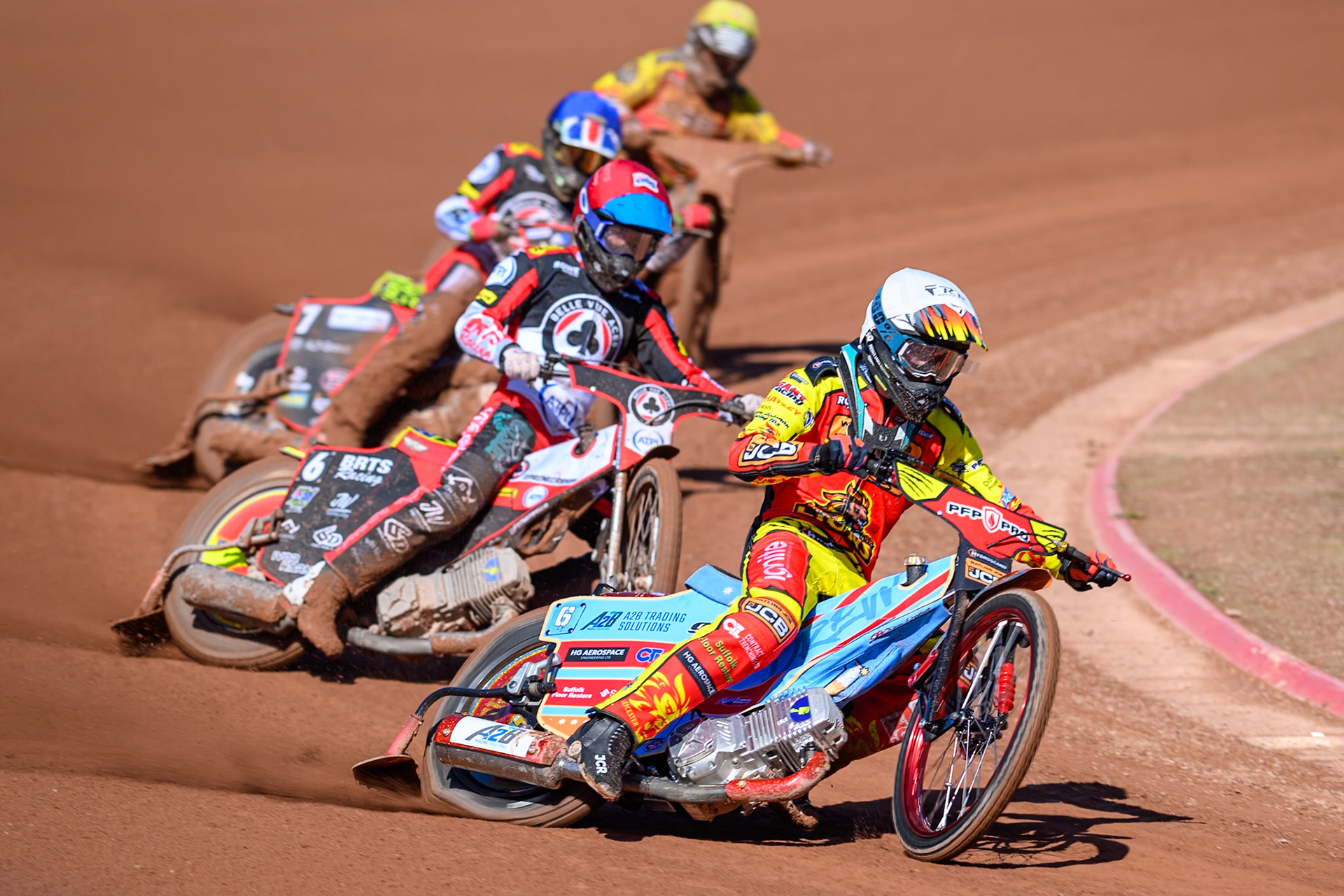Drew Kemp of Leicester Lions  in White leading Tate Zischke of Belle Vue Aces in Red William Cairns of Belle Vue Aces  in Blue and Joe Thompson of Leicester Lions  in Yellow during the Knockout Cup Northern Section match between Belle Vue Aces and Leicester Lions at the National Speedway Stadium, Manchester on Monday 6th April 2026. (Photo: Ian Charles | MI News)