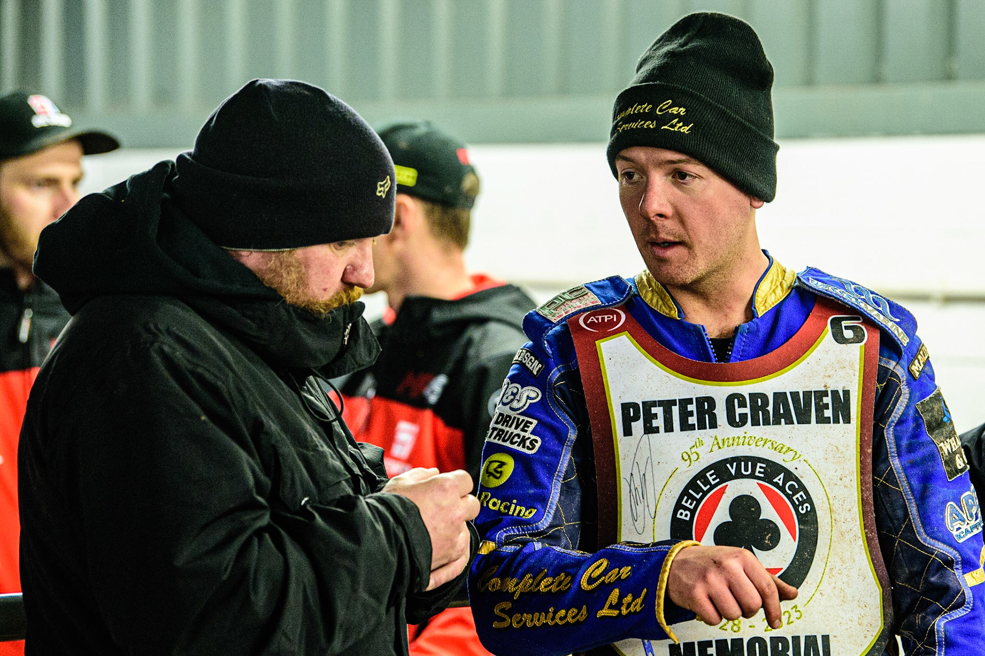 Kyle Howarth  (right) chats with former rider Joe Screen during the Peter Craven Memorial Trophy  at the National Speedway Stadium, Manchester on Monday 3rd April 2023. (Photo: Ian Charles | MI News)