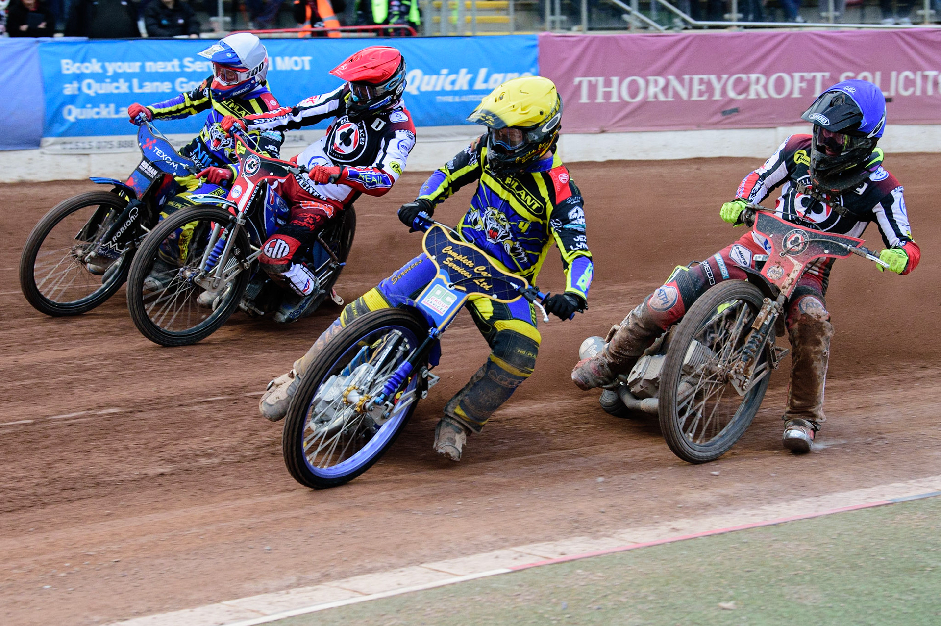 MANCHESTER, UK. JUL 5TH  Kyle Howarth  (Yellow) leads Matej Zagar  (Red) Tobiasz Musielak  (White) with Tom Brennan  (Blue) behind  during the SGB Premiership match between Belle Vue Aces and Sheffield Tigers at the National Speedway Stadium, Manchester on Tuesday 5th July 2022. (Credit: Ian Charles | MI News)