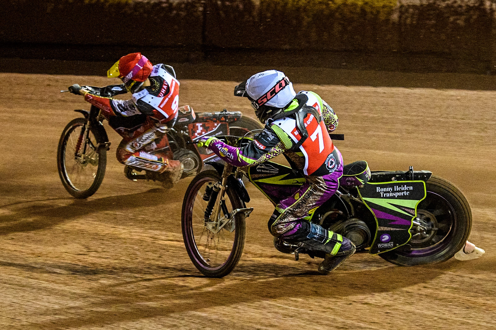 Germany's Celina Liebmann (White) chases Poland's Patryk Wojdylo (Red) during the Peter Craven Memorial Trophy meeting at the National Speedway Stadium, Manchester on Monday 18th March 2024. (Photo: Ian Charles | MI News)