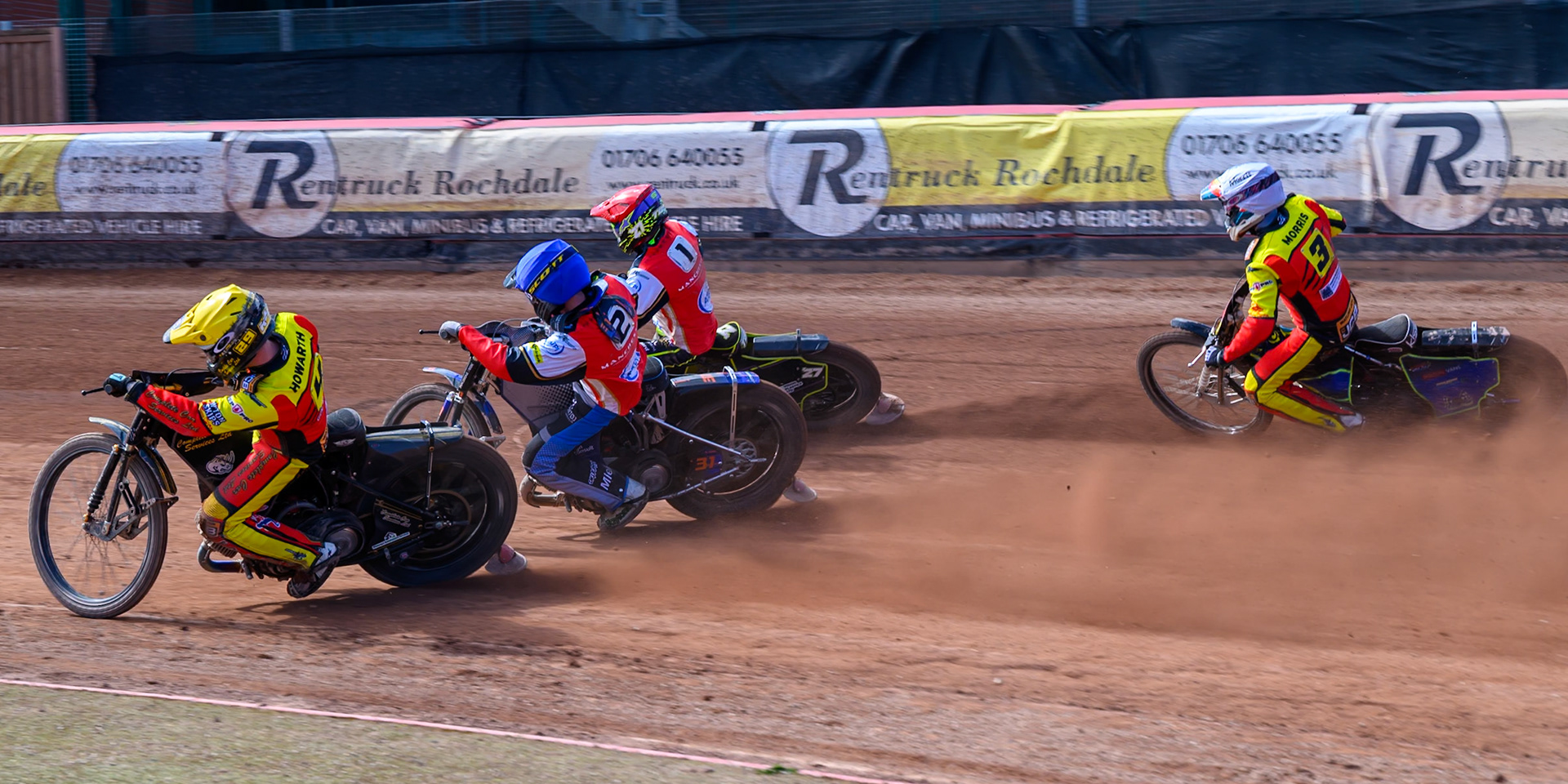 Kyle Howarth of Leicester Lions  in Yellow rides inside Jonas Jeppesen Guest Rider for Belle Vue Aces in Blue and Tom Brennan Guest Rider for Belle Vue Aces  in Red with Nick Morris of Leicester Lions  behind during the Knockout Cup Northern Section match between Belle Vue Aces and Leicester Lions at the National Speedway Stadium, Manchester on Monday 6th April 2026. (Photo: Ian Charles | MI News)