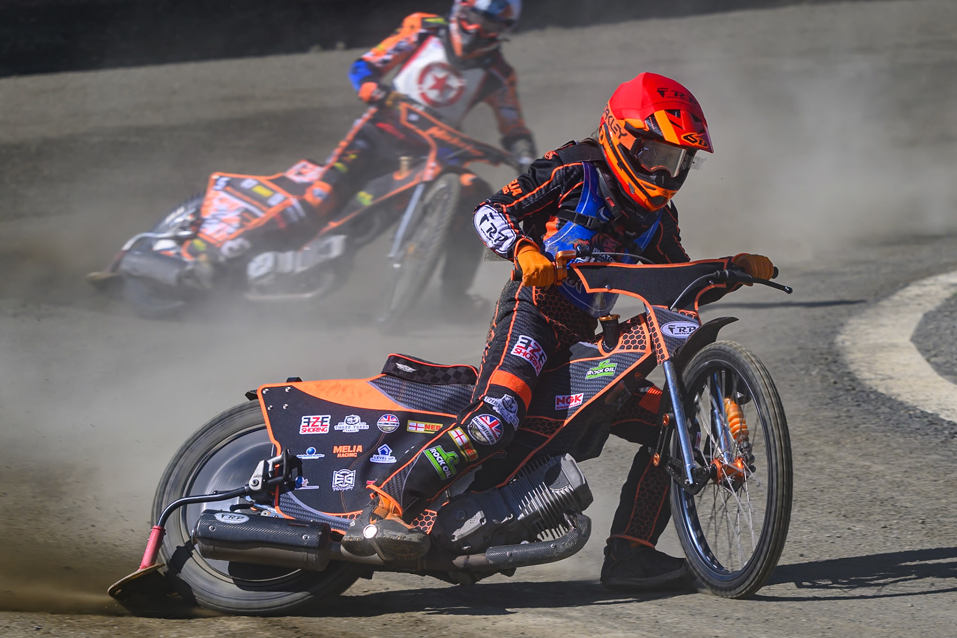 Jack Smith of Buxton Bulls  in Red leading Mickie Simpson of Stoke Potters  in White during the National Development League Challenge match between Buxton Bulls and Stoke Potters at Hi-Edge Speedway, Buxton on Sunday 24th May 2026. (Photo: Ian Charles | MI News)