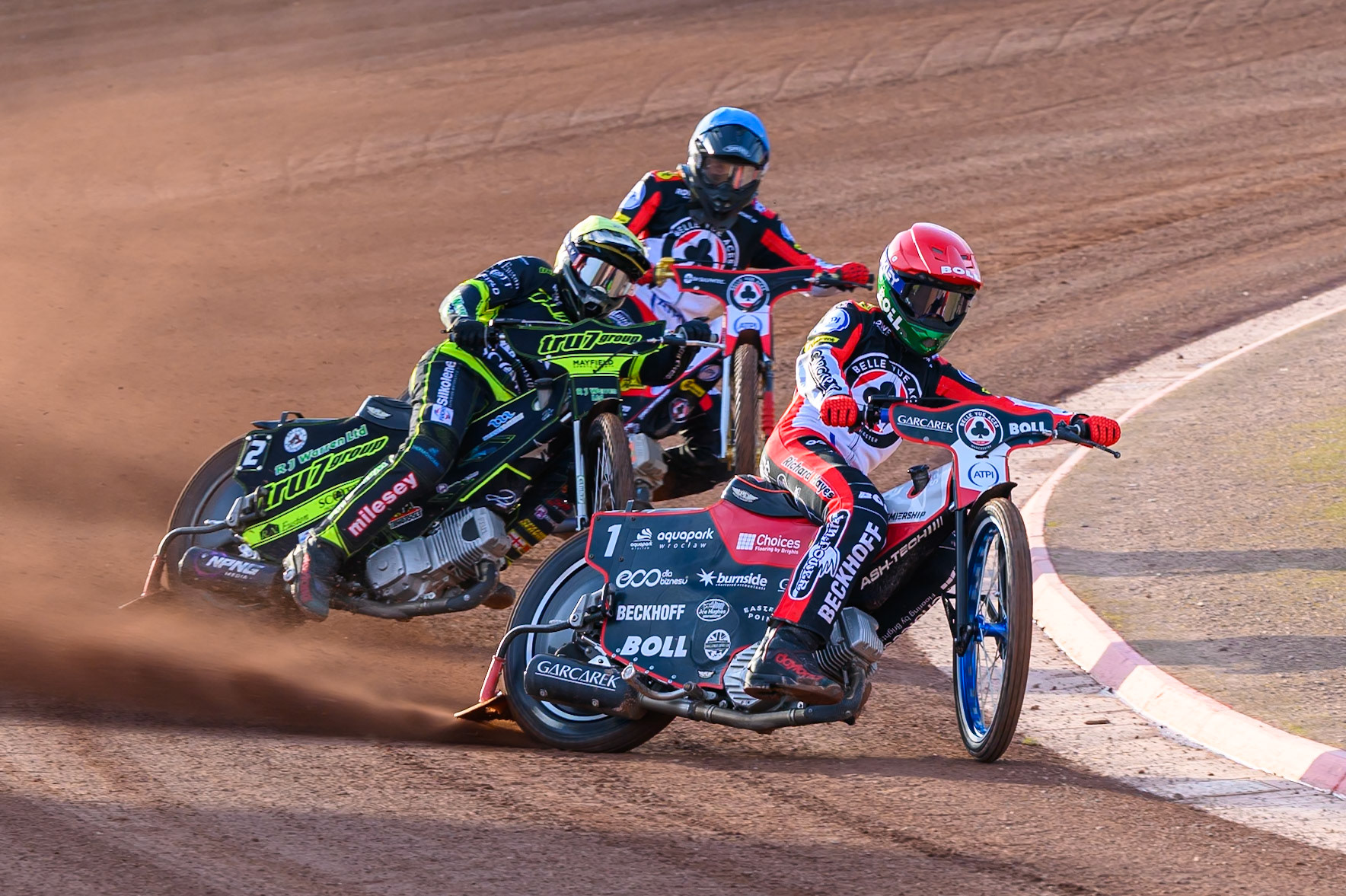 Brady Kurtz of Belle Vue Aces in Red leading Danny King of Ipswich Witches in Yellow and Norick Blödorn of Belle Vue Aces in Blue during the Rowe Motor Oil Premiership match between Belle Vue Aces and Ipswich Witches at the National Speedway Stadium, Manchester on Saturday 20th June 2026. (Photo: Ian Charles | MI News)