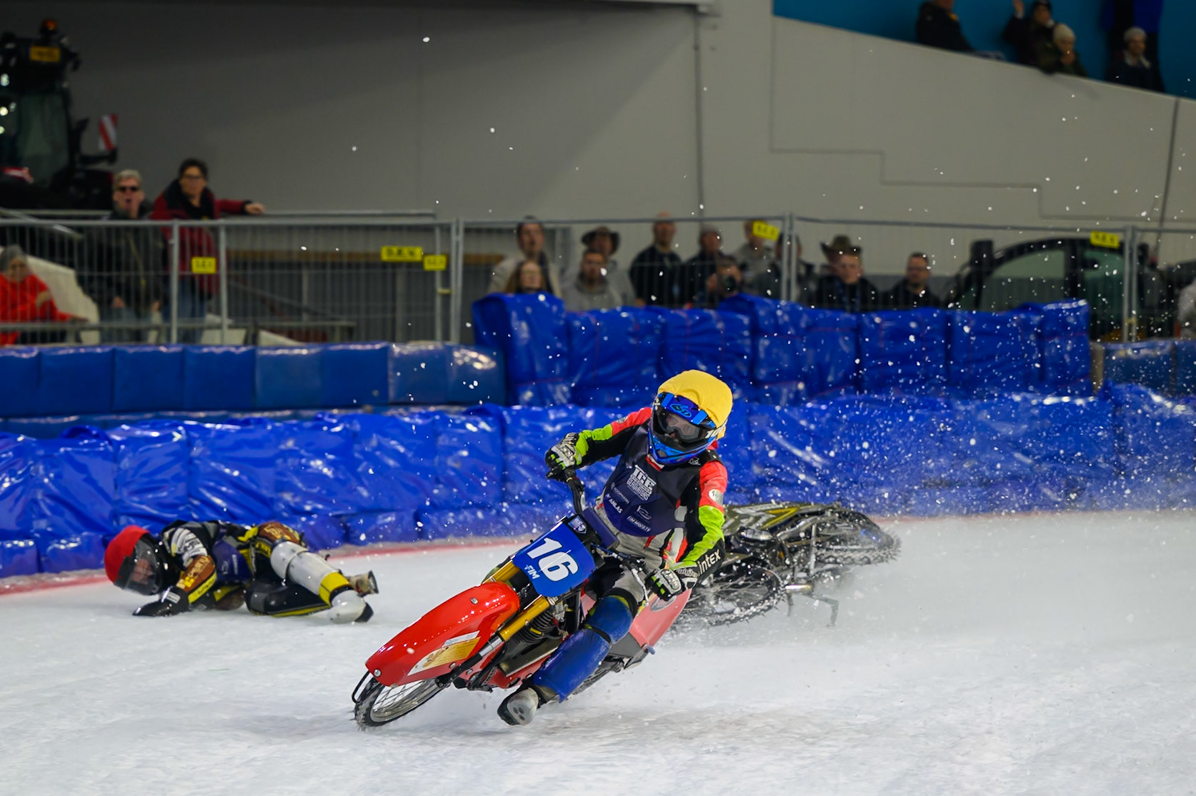 Heikki Huusko (67) of Finland  collides with Wild Card Harald Simon (16) of Austria in Yellow in the first turn during the FIM Ice Speedway Gladiators World Championship Final 3 at Ice Rink Thialf, Heerenveen on Saturday 11th April 2026. (Photo: Ian Charles | MI News)