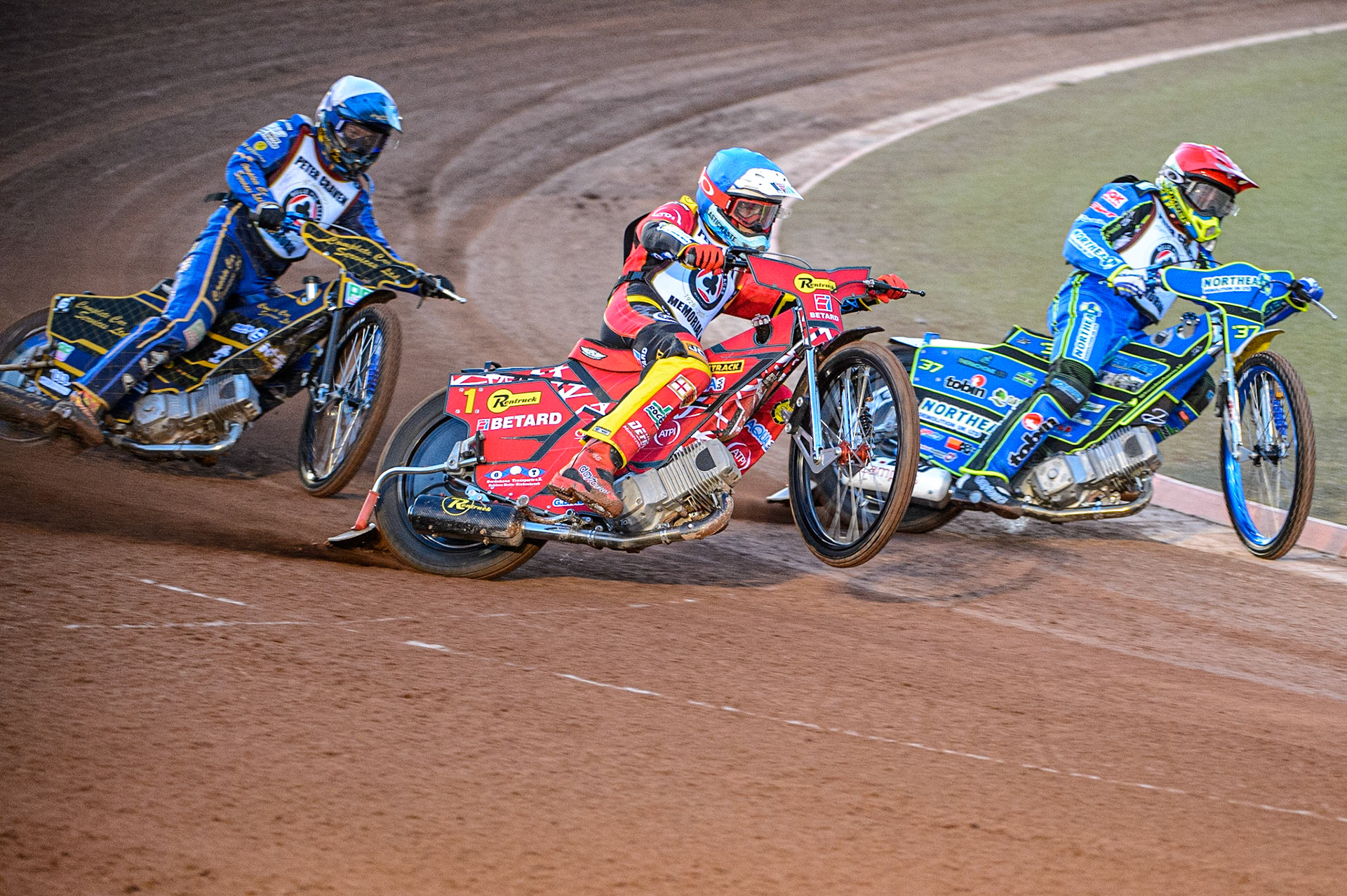 Max Fricke  (Blue) picks up some drive outside Chris Harris (Red) with Kyle Howarth (White) behind during the Peter Craven Memorial Trophy  at the National Speedway Stadium, Manchester on Monday 3rd April 2023. (Photo: Ian Charles | MI News)