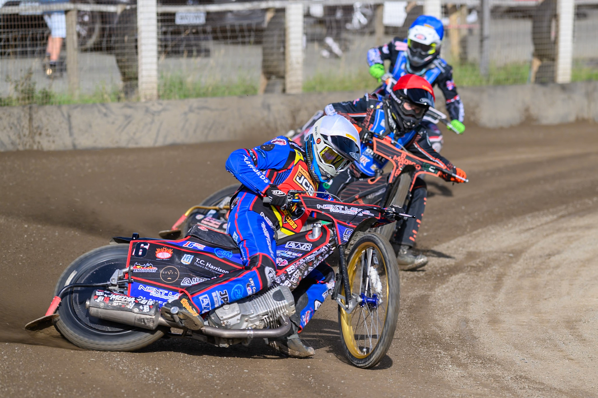 Emerson Betty, Guest rider for Leicester Lion Cubs  in White leading Bailey Fellows, Guest Rider for Buxton Bulls   in Red  and Jack Shimelt of Buxton Bulls  in Blue during the WSRA National Development League match between Buxton Bulls and Leicester Lion Cubs at Hi-Edge Speedway, Buxton on Sunday 4th October 2026. (Photo: Ian Charles | MI News)