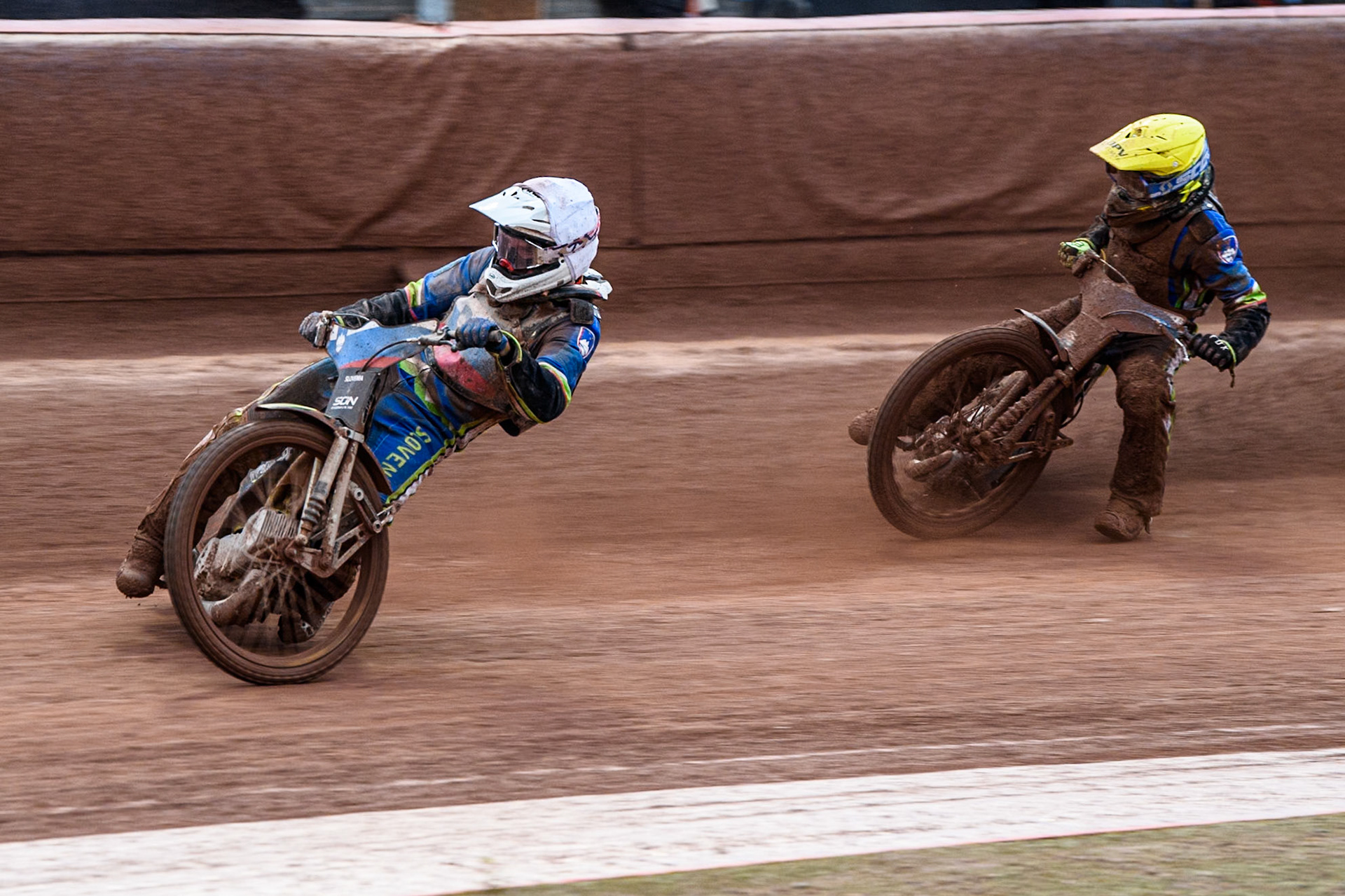 Anze Grmek of Slovenia in White leading team mate Matic Ivacic of Slovenia in Yellow during the Monster Energy FIM Speedway of Nation Semi Final 2 at the National Speedway Stadium, Manchester on Wednesday 10th July 2024. (Photo: Ian Charles | MI News)