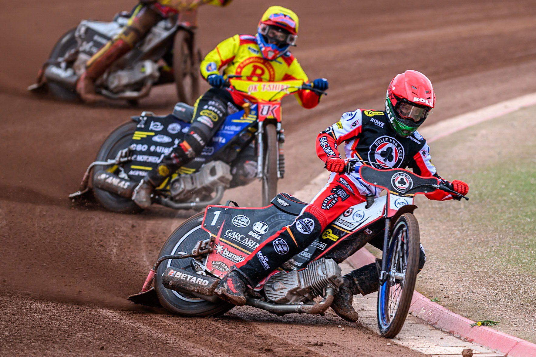 Belle Vue Aces' Brady Kurtz  in Red leading Birmingham Brummies' Paco Castagna  in Yellow during the Rowe Motor Oil Premiership match between Belle Vue Aces and Birmingham Brummies at the National Speedway Stadium, Manchester on Monday 7th July 2025. (Photo: Ian Charles | MI News)