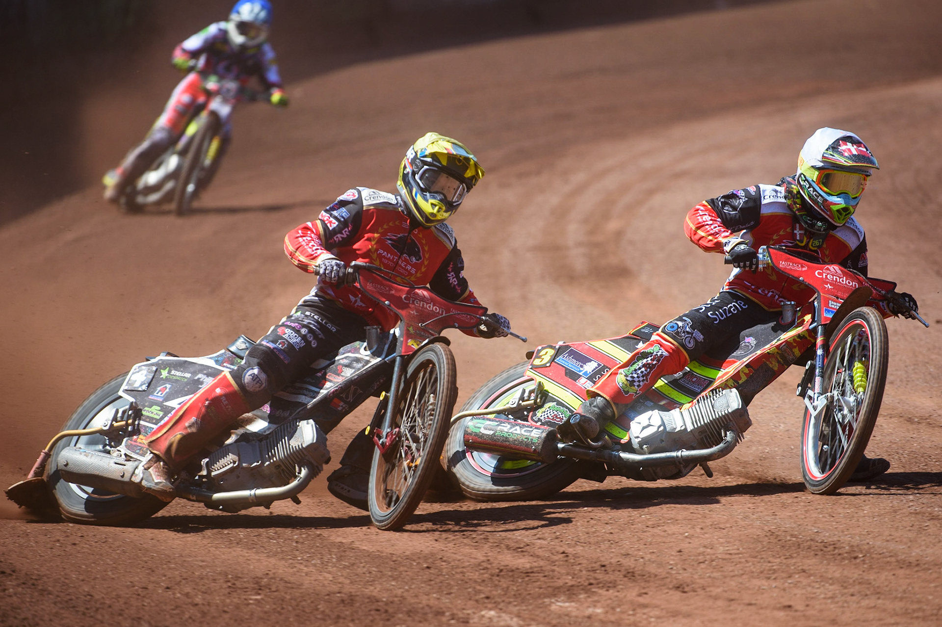 MANCHESTER, UK. MAY 31ST  Michael Palm Toft  (White) and Scott Nicholls  (Yellow) lead  Tom Brennan  (Blue) during the SGB Premiership match between Belle Vue Aces and Peterborough at the National Speedway Stadium, Manchester on Monday 31st May 2021. (Credit: Ian Charles | MI News)