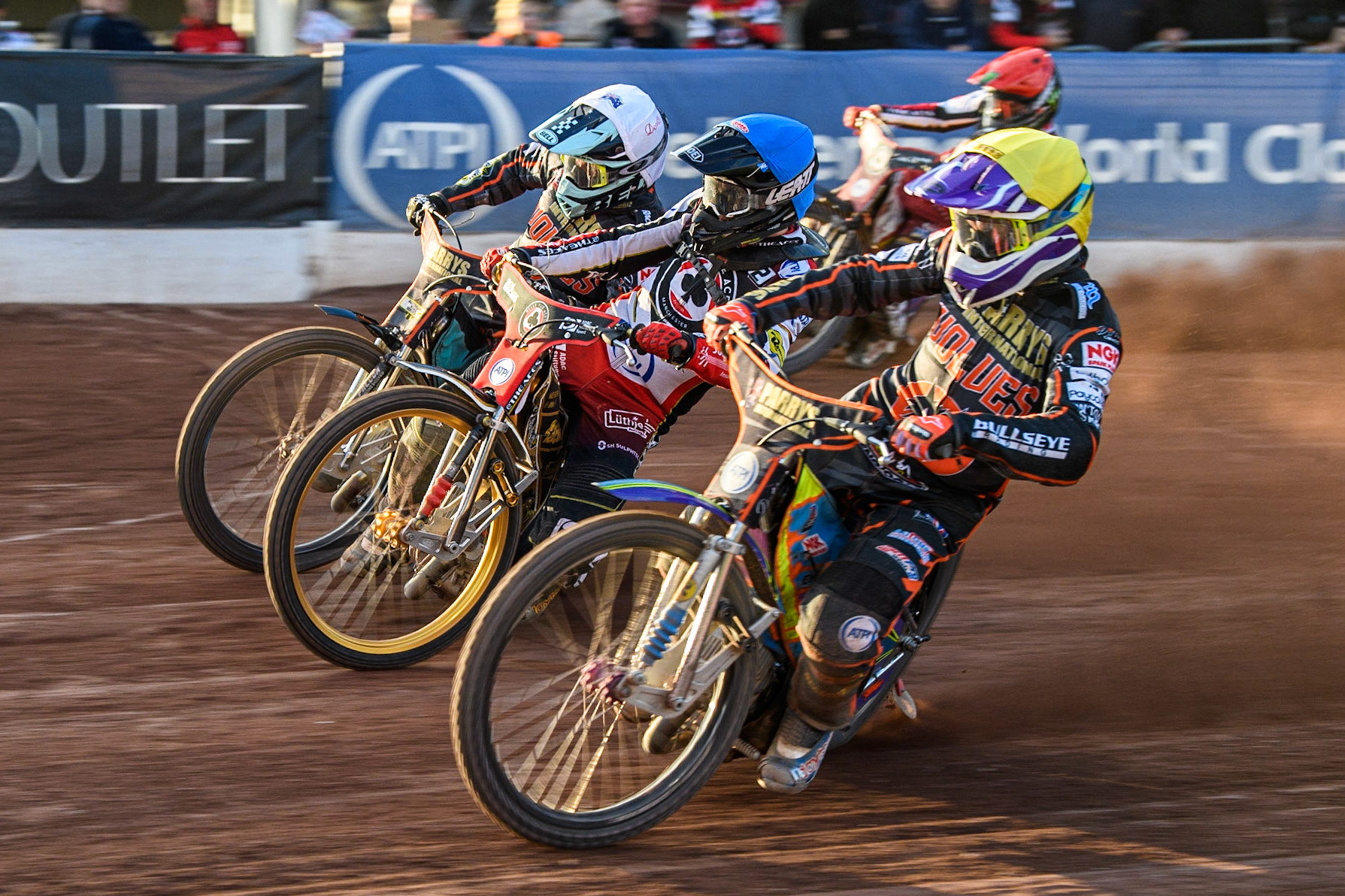 Norick Blodorn (Blue) rides between Rory Schlein (Yellow) and Ryan Douglas (White) during the Sports Insure Premiership match between Belle Vue Aces and Wolverhampton Wolves at the National Speedway Stadium, Manchester on Monday 3rd July 2023. (Photo: Ian Charles | MI News)