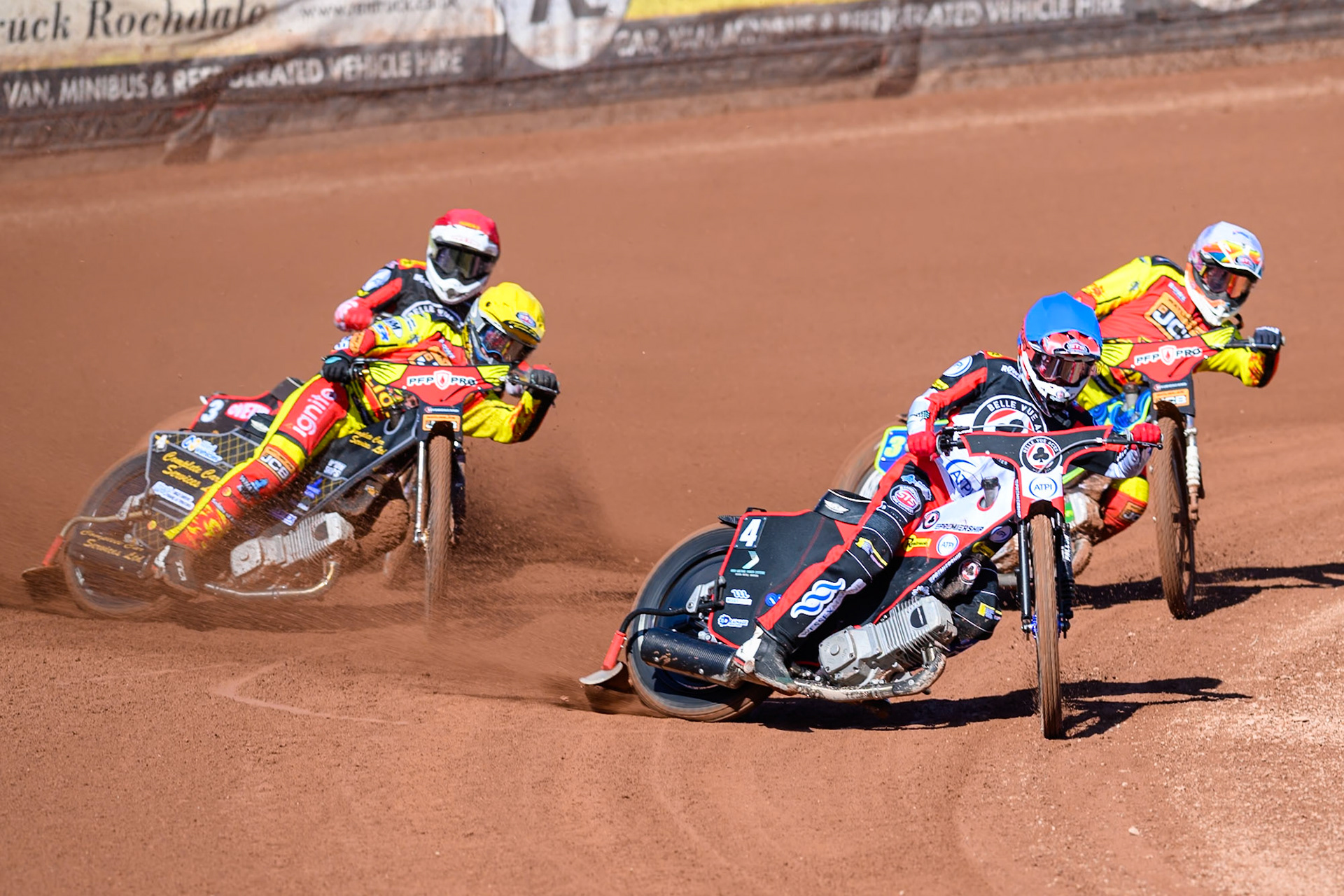 Zach Cook of Belle Vue Aces in Blue leading Nick Morris of Leicester Lions in White Kyle Howarth of Leicester Lions  in Yellow and Peter Kildemand of Belle Vue Aces in Red during the Knockout Cup Northern Section match between Belle Vue Aces and Leicester Lions at the National Speedway Stadium, Manchester on Monday 6th April 2026. (Photo: Ian Charles | MI News)